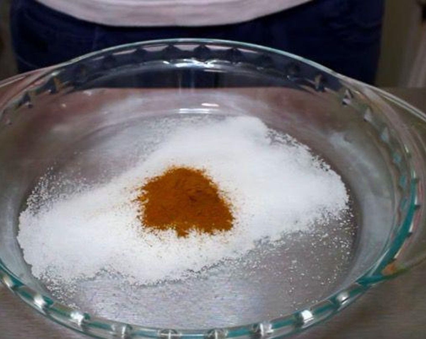 step 3 In a bowl add some sugar, Ground Cinnamon and whisk together. Dip the toast in the cinnamon sugar. Serve with Maple Syrup (to taste).