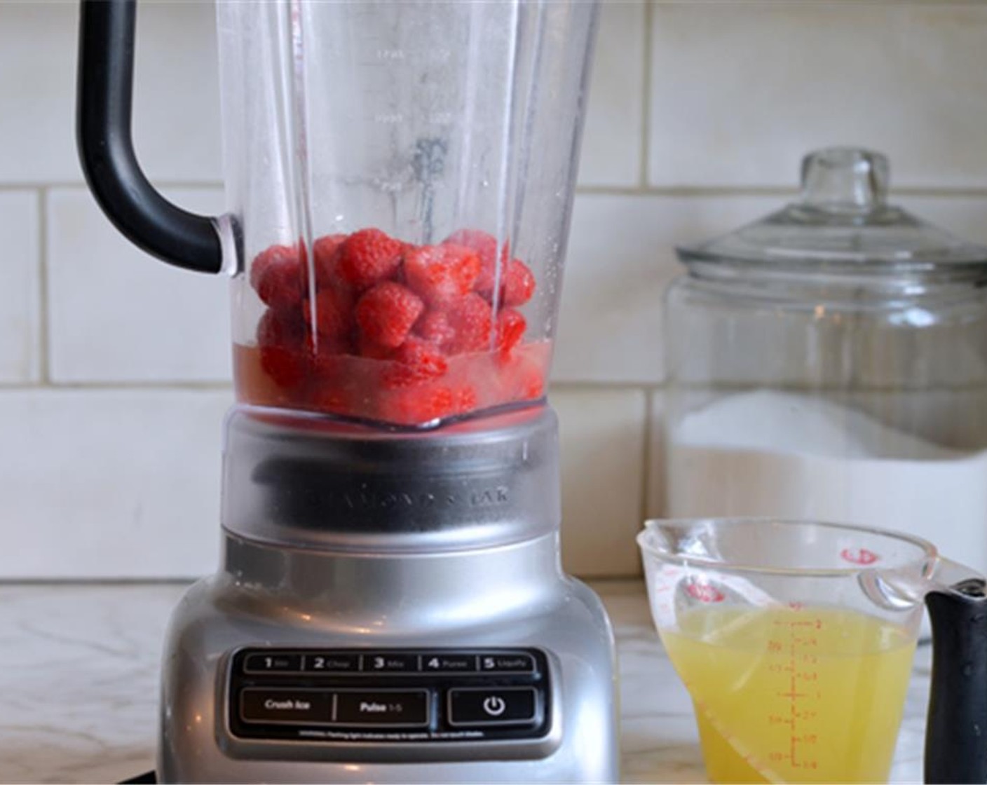 step 1 Combine the Fresh Raspberries (1 3/4 cups) and the juice from Lemons (9) in a blender.
