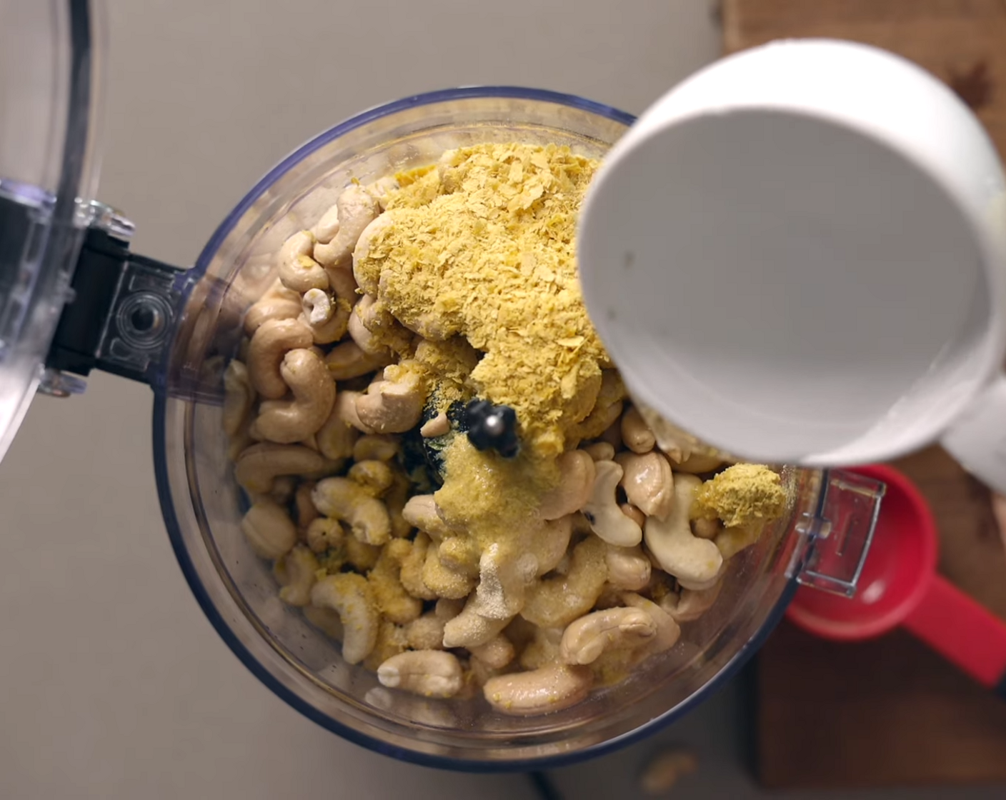 step 2 Discard soaking water from Raw Cashews (3 cups) and add to a high power food processor or blender together with 3 Tbsp of Lemons (2), Nutritional Yeast (4 Tbsp), Garlic Powder (1 Tbsp), Fine Sea Salt (1/2 tsp), and Water (1 cup). Blend until creamy. Set aside.