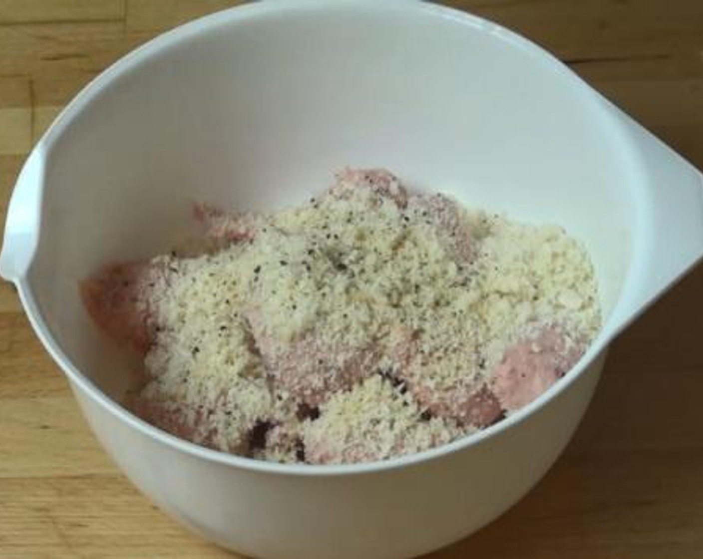 step 1 Into a bowl, squeeze the meat out of each Pork Sausages (6). To that, add the Breadcrumbs (1/2 cup), Garlic Powder (1 tsp), Salt (to taste), and Ground Black Pepper (to taste). Mix together with your hands.