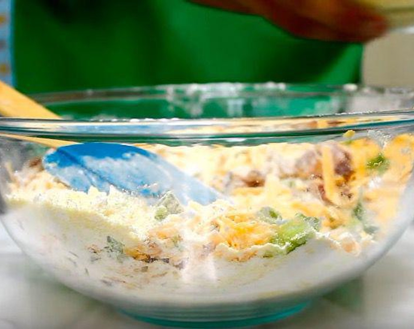 step 4 In another mixing bowl, add Granulated Sugar (1/3 cup), Cornmeal (1 cup), All-Purpose Flour (1 cup), Baking Powder (2 tsp), Baking Soda (1/2 tsp), Salt (1/2 tsp), Cheddar Cheese (1 1/2 cups), Scallion (1/2 cup) and Chopped, Cooked Bacon. Mix until incorporated.