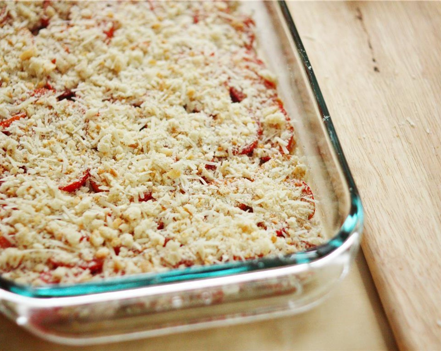 step 4 In a small bowl, combine Breadcrumbs (1/2 cup), Parmesan Cheese (4 Tbsp), Pecorino Romano Cheese (4 Tbsp), and Garlic (2 cloves) and mix with a fork. Sprinkle the mixture evenly over the tomatoes. Sprinkle Salt (1/4 tsp) and Ground Black Pepper (1/4 tsp) over the tomatoes and bread crumb mixture.