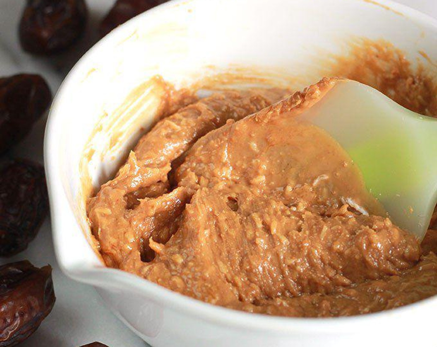 step 1 In a medium bowl, combine Nut Butter (1 cup) and Unsweetened Coconut Flakes (4 Tbsp). Set aside.
