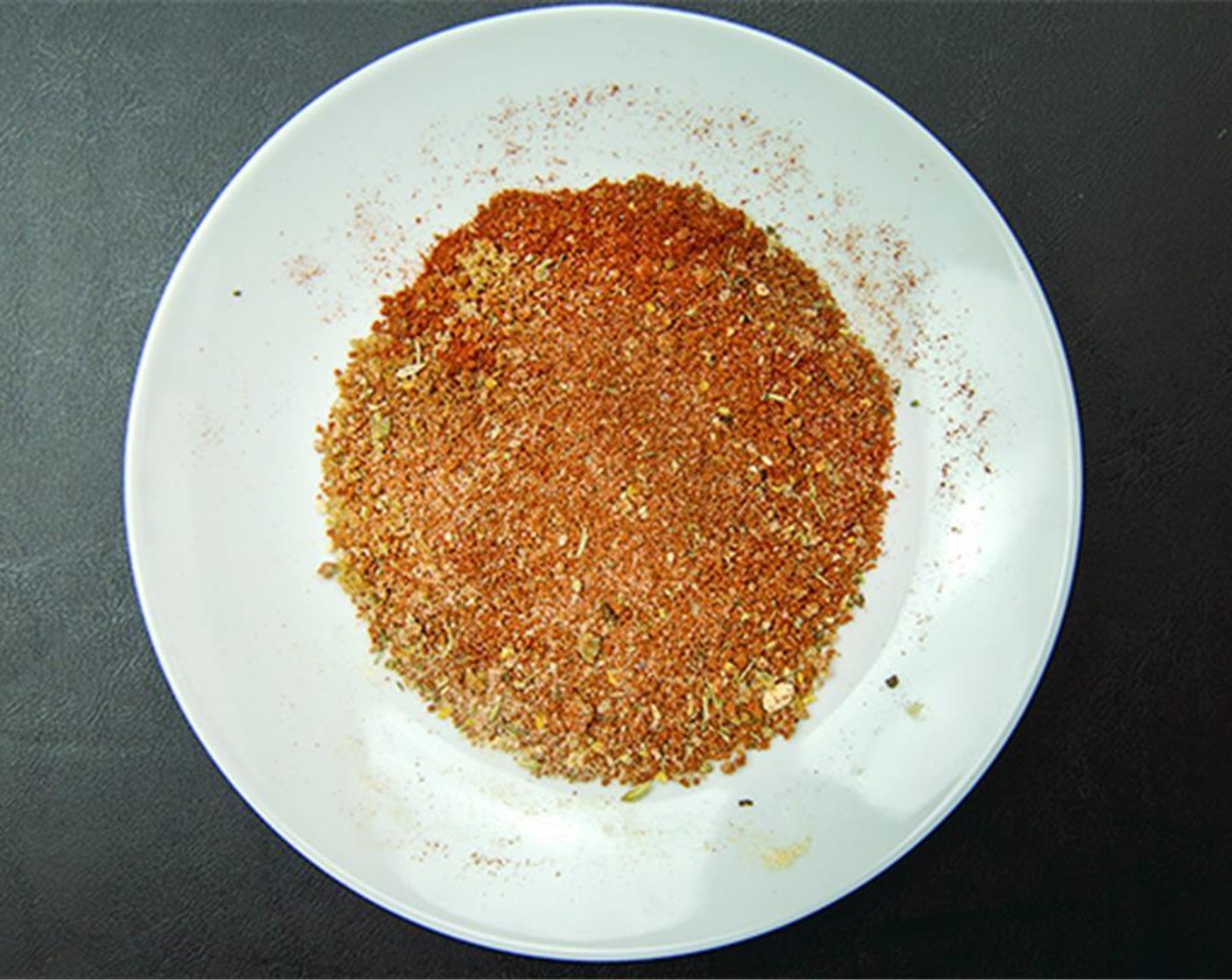 step 3 Combine Onion Powder (1/2 tsp), Brown Sugar (2 tsp), Garlic Powder (1/2 tsp), Paprika (1 1/2 Tbsp), Poultry Seasoning (1/2 tsp), freshly ground Ground Black Pepper (1/2 tsp), Chili Powder (1/2 tsp), and Cayenne Pepper (1 pinch).