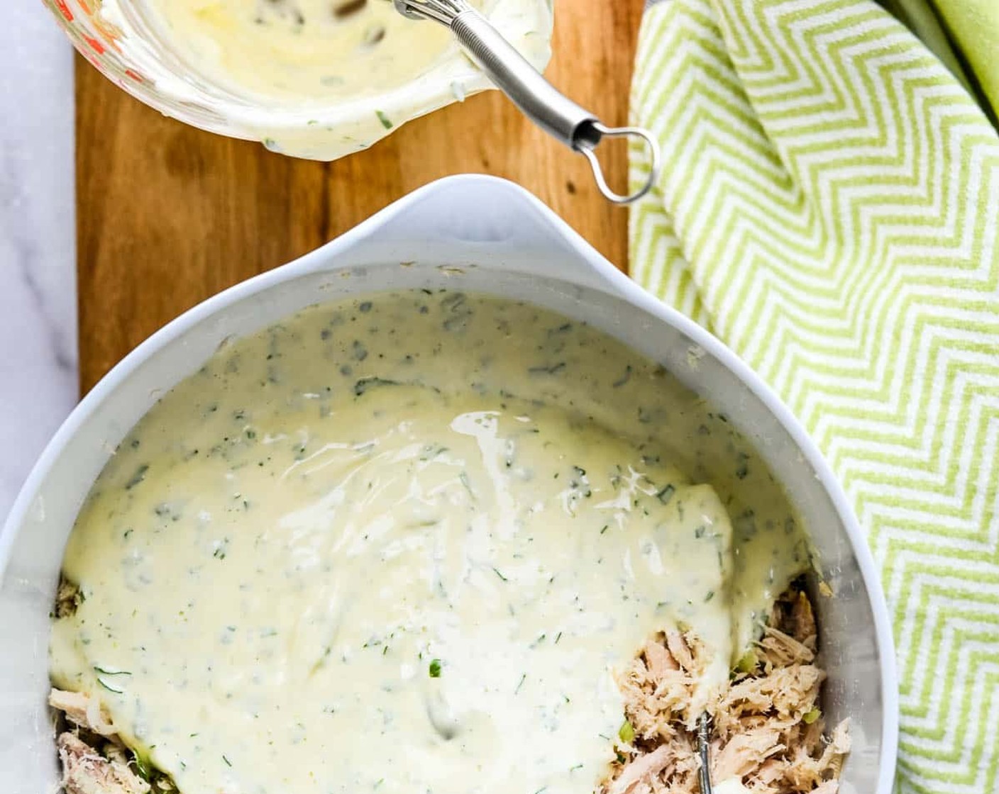 step 3 Pour the mayonnaise mixture over the tuna salad and toss until well combined. If the tuna is too dry for your tastes, add more, 1 tablespoon at a time until it’s the way you like it. Adjust seasonings if necessary.