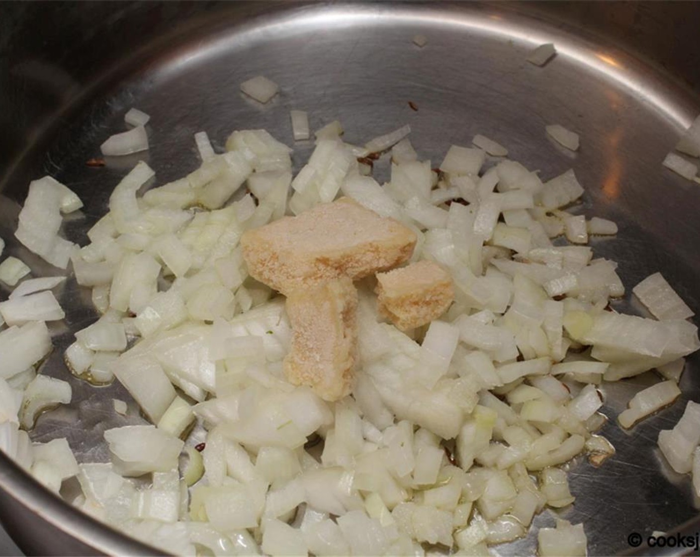 step 7 Add Onion (1 cup) and Ginger Garlic Paste (1 tsp).