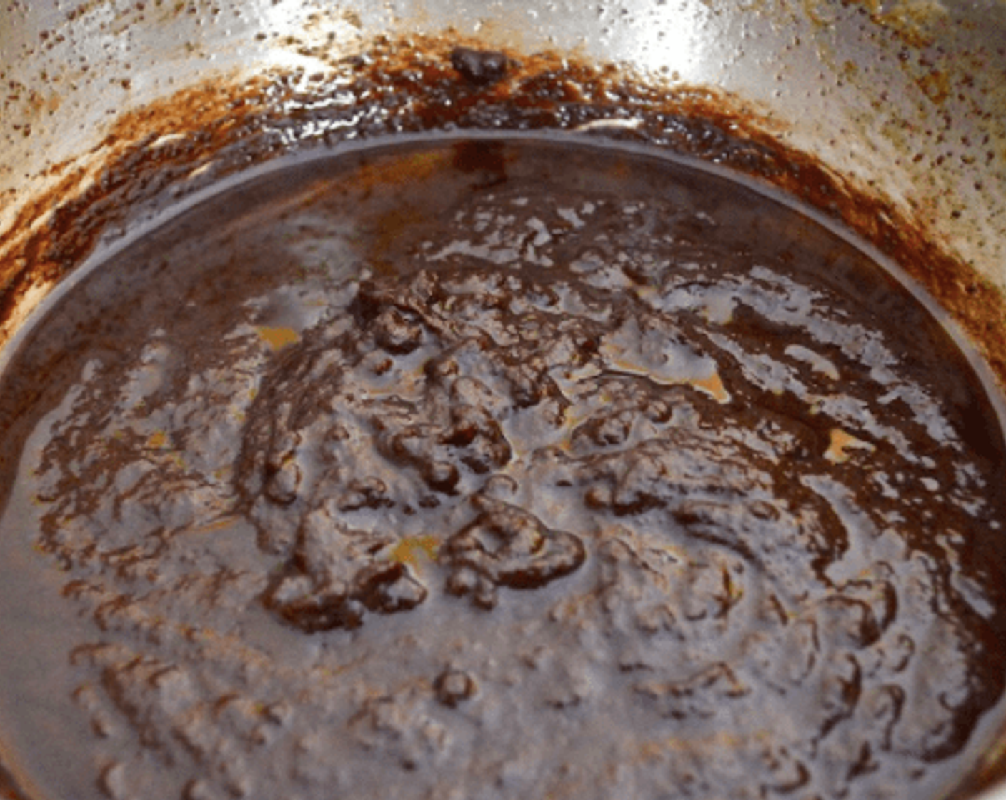 step 3 Then return the egg mixture back into the pan, along with the Unsweetened Cocoa Powder (1 Tbsp) and Godiva® Chocolate Liqueur (1/4 tsp). Stir it constantly until it cooks through and thickens for about 5 minutes. Stir in the Dark Chocolate Chips (1 cup) until they melt in.