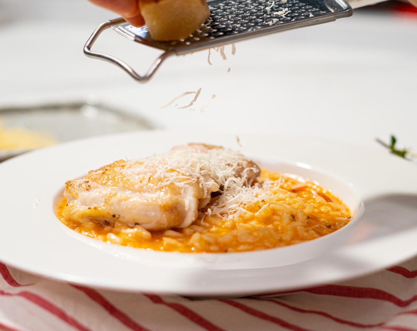 step 10 Serve risotto immediately in large shallow bowls topped with the chicken. Garnish with extra parmesan and fresh thyme leaves.