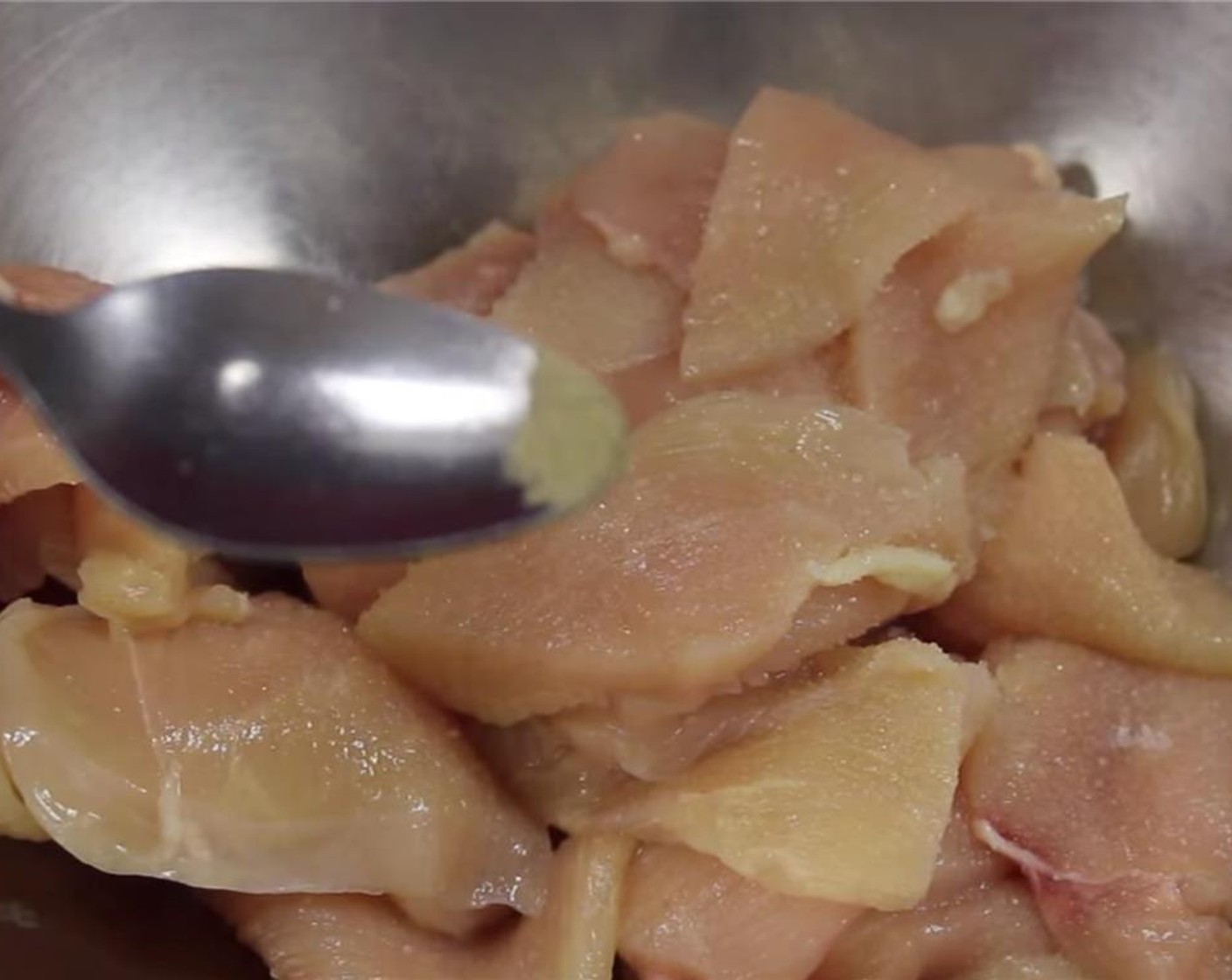step 5 Add chicken to a bowl along with Salt (1/2 tsp), Ground White Pepper (1/8 tsp), Garlic Powder (1/4 tsp), Water (4 Tbsp) and mix.