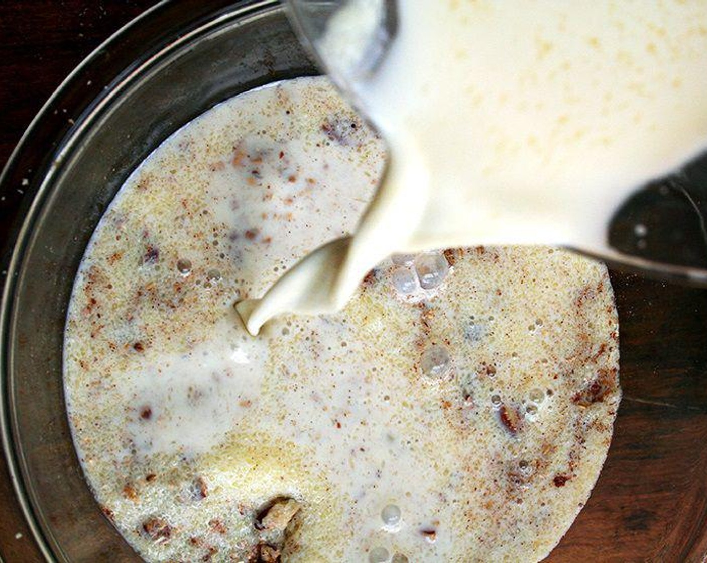 step 2 In a medium bowl, whisk together the Whole Milk (2 cups), Maple Syrup (4 Tbsp), Large Egg (1), Unsalted Butter (3 Tbsp) and Vanilla Extract (2 tsp). Pour the milk mixture over the oat mixture, and shake the pan to distribute.