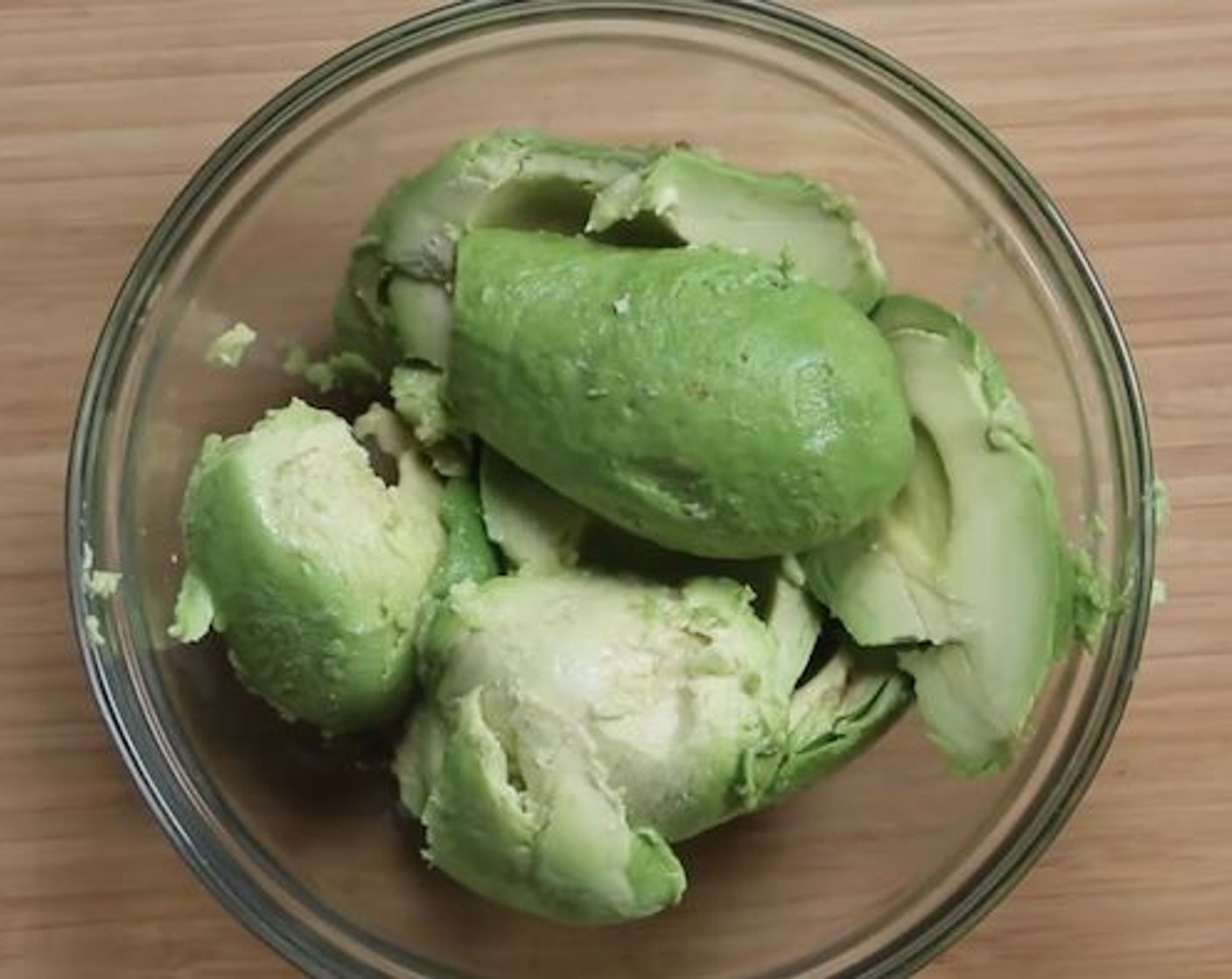 step 3 Add the Avocados (2) into a bowl along with Lime (1/2) into a bowl. Season with Salt (to taste) and mash until smooth.