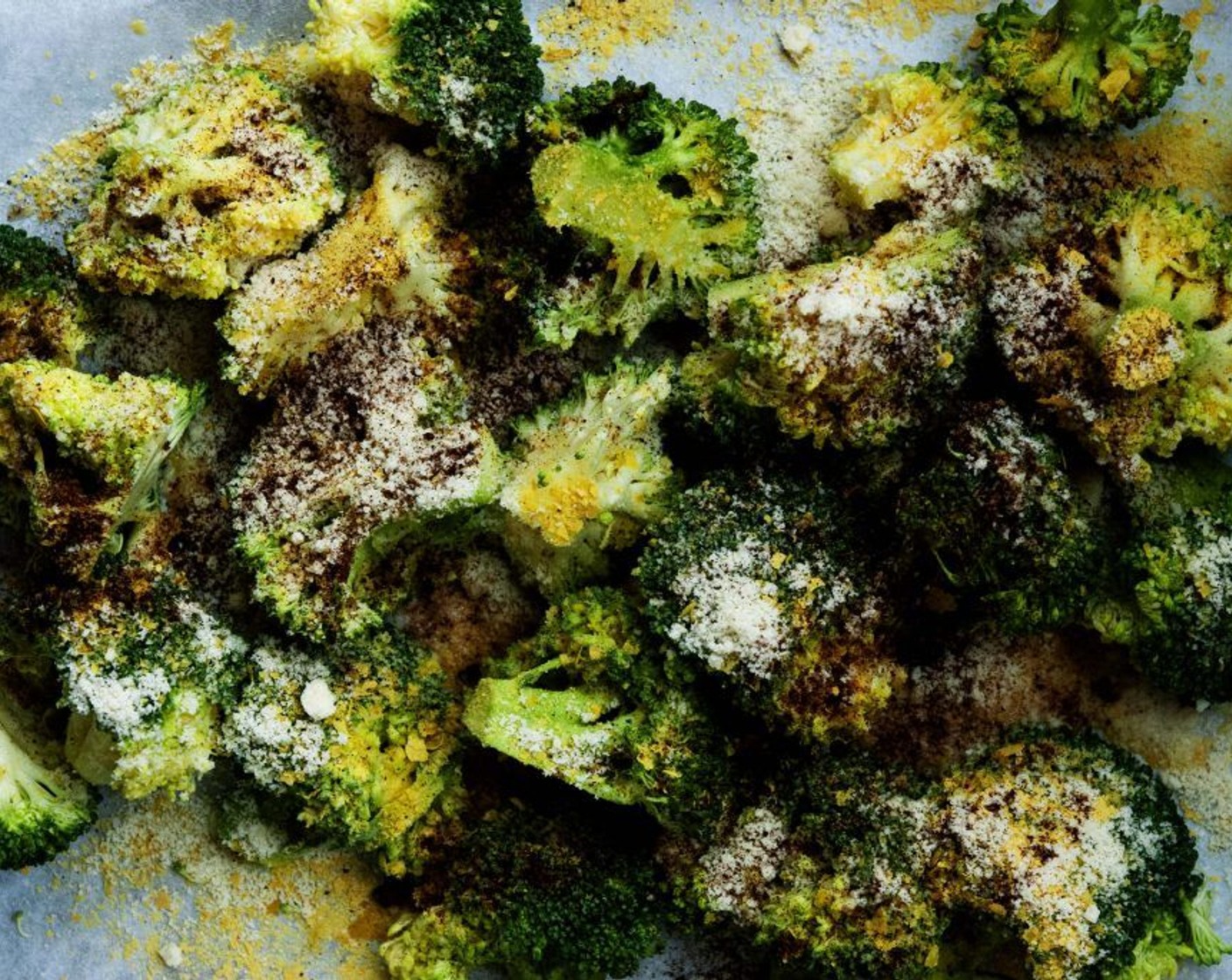 step 2 Chop your Broccoli (6 cups) into florets and spread them on a baking sheet. Drizzle with Extra-Virgin Olive Oil (4 Tbsp), Nutritional Yeast (3 Tbsp), Almond Flour (3 Tbsp), Salt (1 tsp) and Paprika (1/2 tsp).