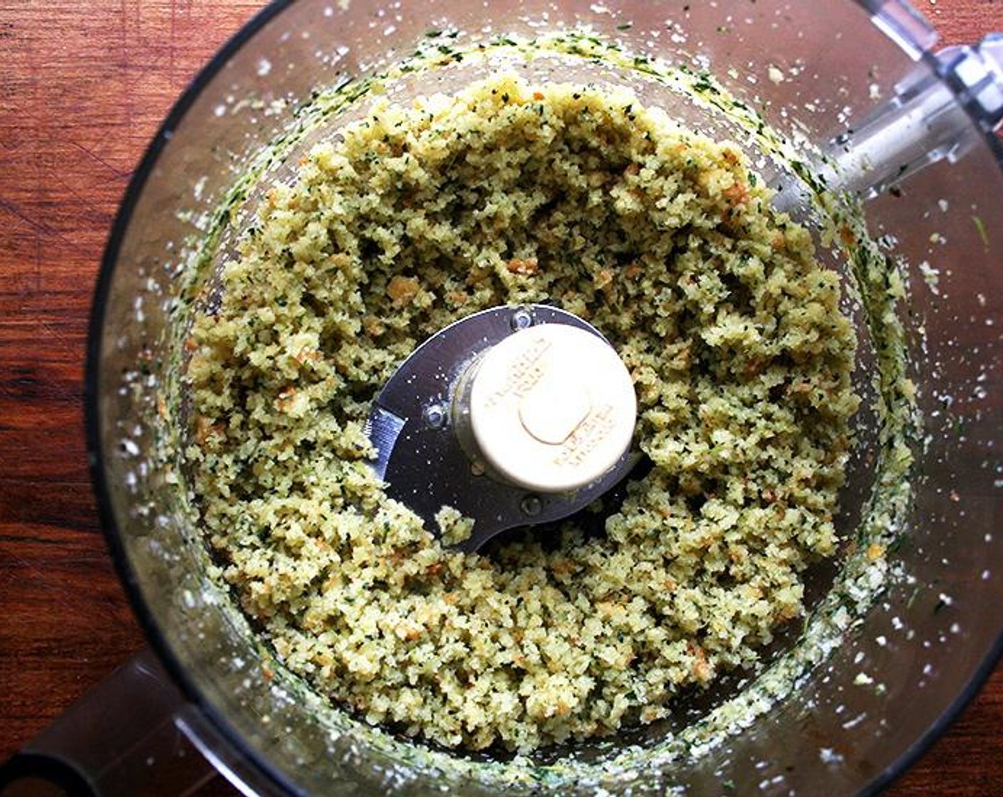 step 5 Add the Breadcrumbs (2 cups) and Olive Oil (4 Tbsp), and pulse a few times to moisten the breadcrumbs. Pour the mixture into a wide, shallow bowl or onto a large plate — something with sides is best.