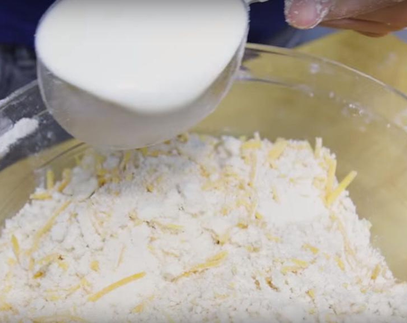 step 2 In a large bowl, whisk All-Purpose Flour (3 cups), Caster Sugar (1 Tbsp), Baking Powder (1 tsp), Baking Soda (1 tsp), Salt (1 tsp) and Garlic Powder (2 tsp) until combined. Add in the Butter (1 1/2 sticks) and using your fingers, rub it into the flour mixture until it resembles coarse meal. Add in the Cheddar Cheese (2 cups), then Buttermilk (1 1/2 cups) and mix until combined.