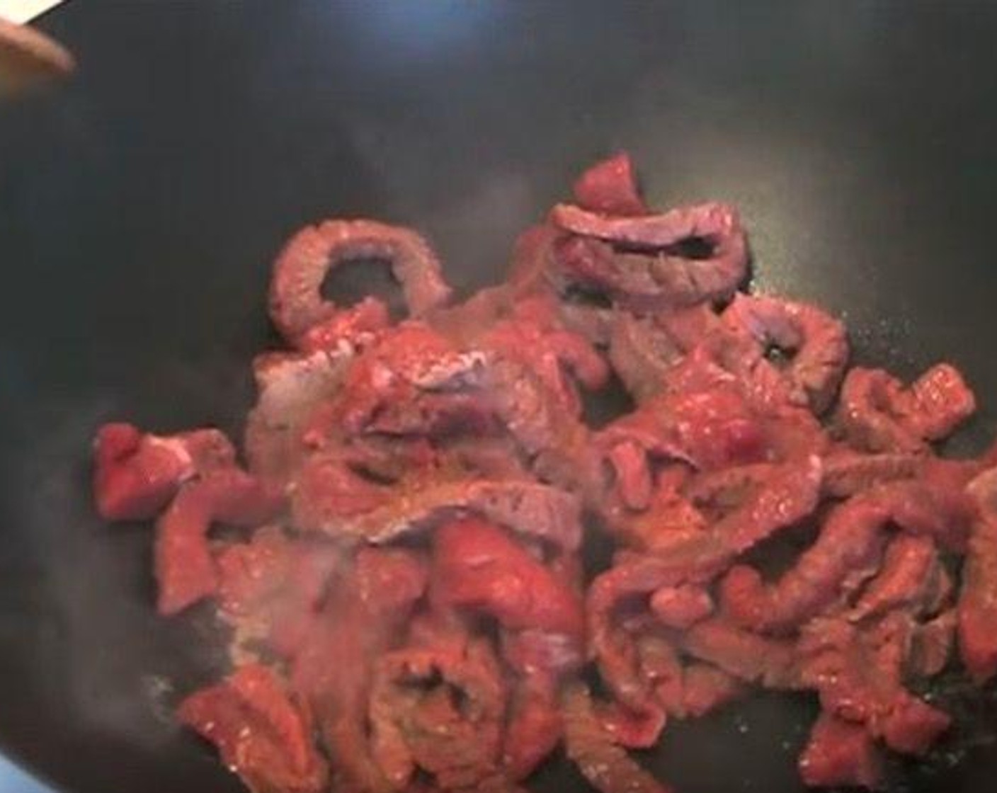 step 2 In a wok, heat Vegetable Oil (as needed). Add Beef Strips (1.1 lb) and cook for 4-5 minutes, or until meat is browned. Transfer to a clean bowl.