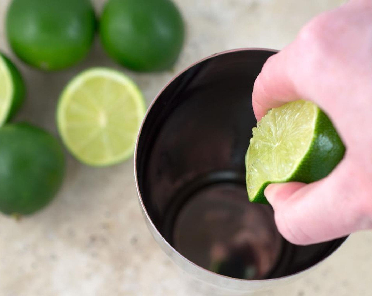 step 4 Add Tequila (2 fl oz) and juice from Limes (3) into a cocktail shaker or into a measuring cup. Add the simple syrup (water and sugar mixture).