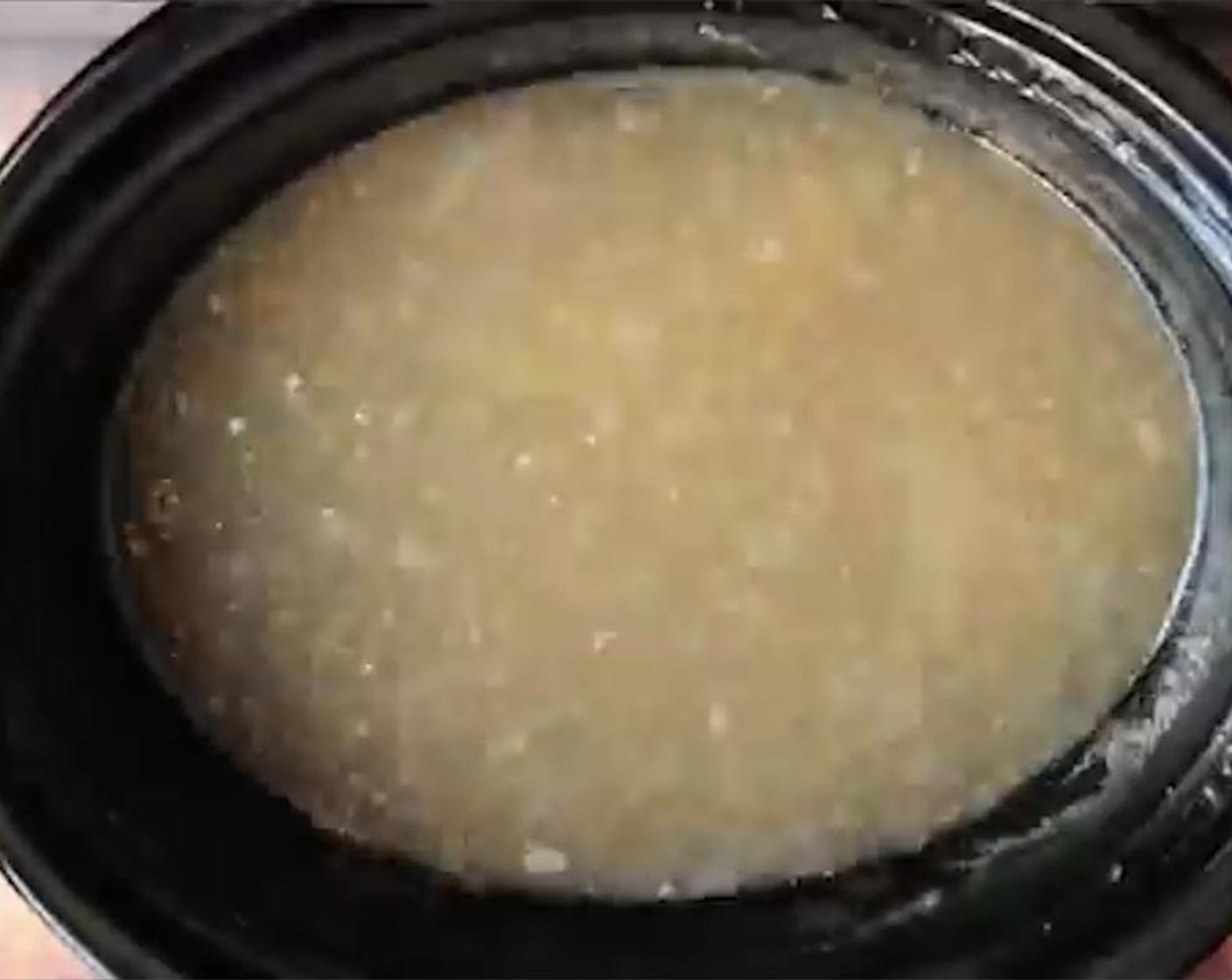 step 3 Let the broth settle for 5 minutes and remove as much fat as possible from the surface using a large spoon. Remove the solids.