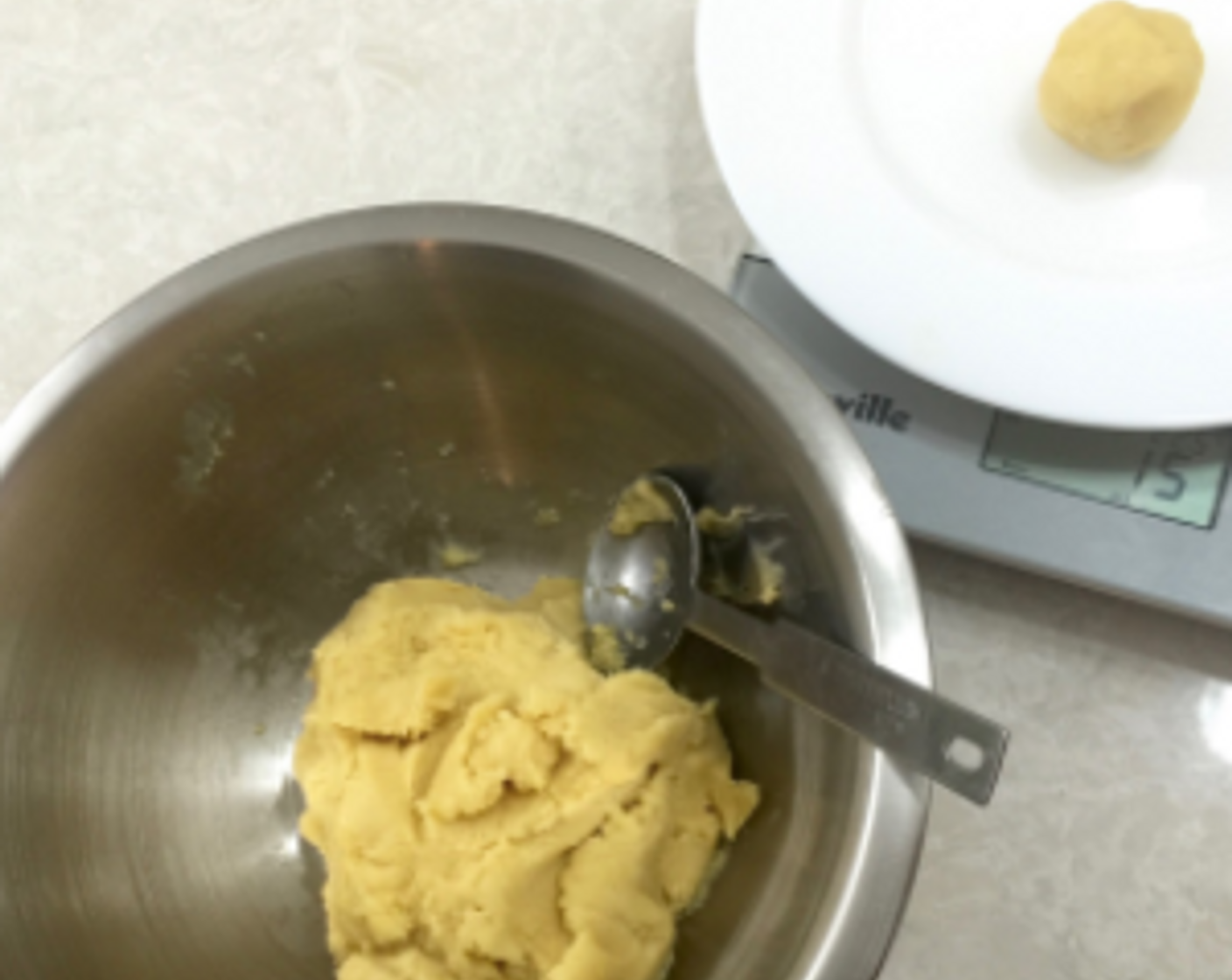step 19 Using a tablespoon, weight each dough to 15g and roll into balls. You will have 20 balls. Weighing ensures the balls are of the same size and will bake evenly and the same amount of time.