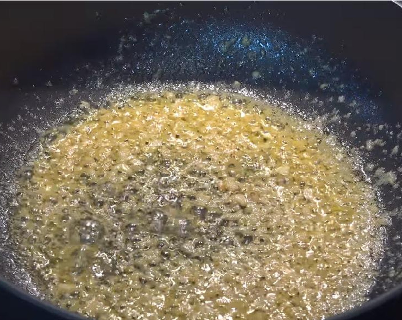 step 3 Rinse and dry the pan, then put it on medium heat. Add Butter (1 oz). Once it is melted, add Garlic (3 cloves), and stir until the garlic becomes aromatic.