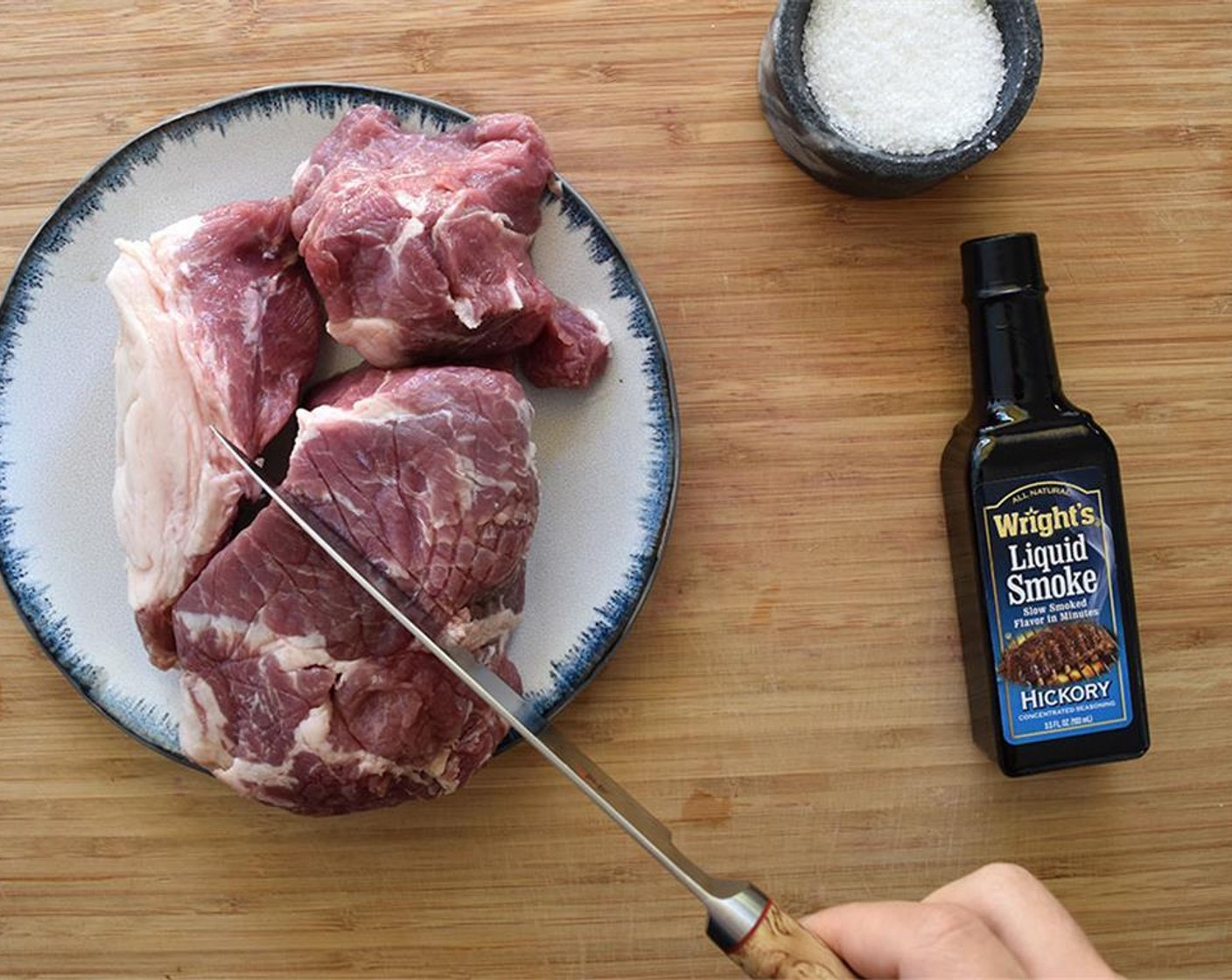 step 2 Make 1/4 inch cuts into your pork all over. Then rub the pork with 2 tablespoons of salt.