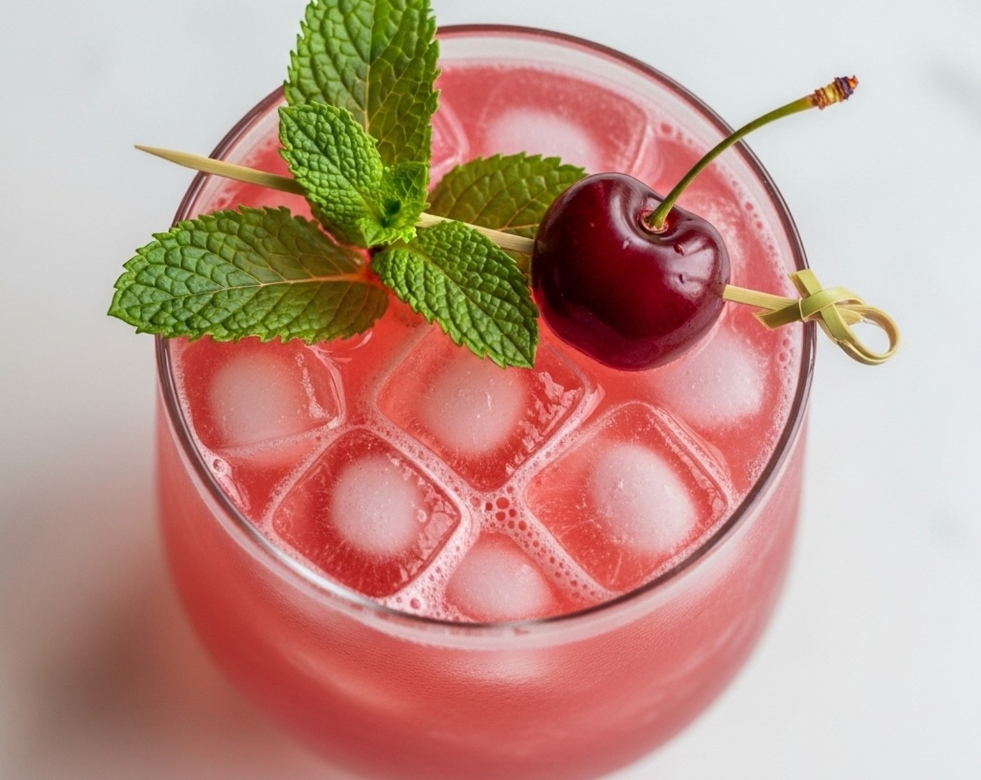 step 3 Garnish with Cherries (to taste) and Fresh Mint (1 sprig). Serve, and enjoy!