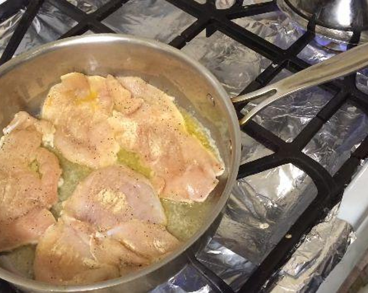 step 3 In a pan with high sides, over medium high heat, melt the Butter (4 Tbsp). Add the chicken and cook for about 4 minutes on each side until cooked through. Remove chicken from the pan and cut into bite size pieces.