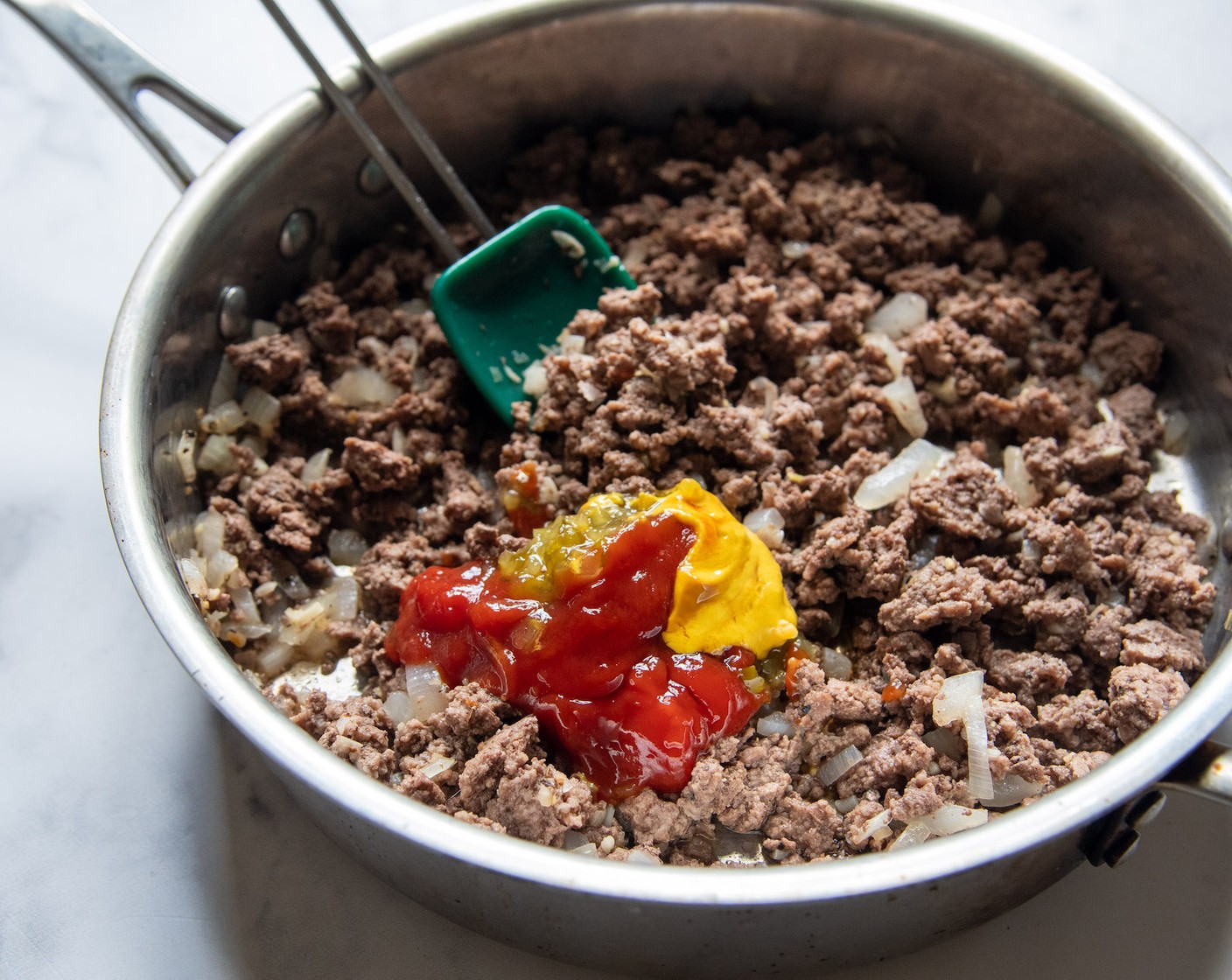 step 2 Add the Worcestershire Sauce (1 tsp), Ketchup (2 Tbsp), Pickle Relish (1 Tbsp), Yellow Mustard (2 tsp), and stir to combine. Pour in the Beef Broth (1 can) and bring to a boil.