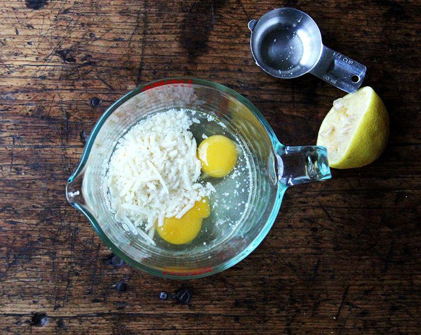 step 6 In a medium bowl or liquid measure, whisk together Large Eggs (2), Parmigiano-Reggiano (4 Tbsp), and juice from Lemon (1). Whisk ¼ cup pasta water into the egg mixture.