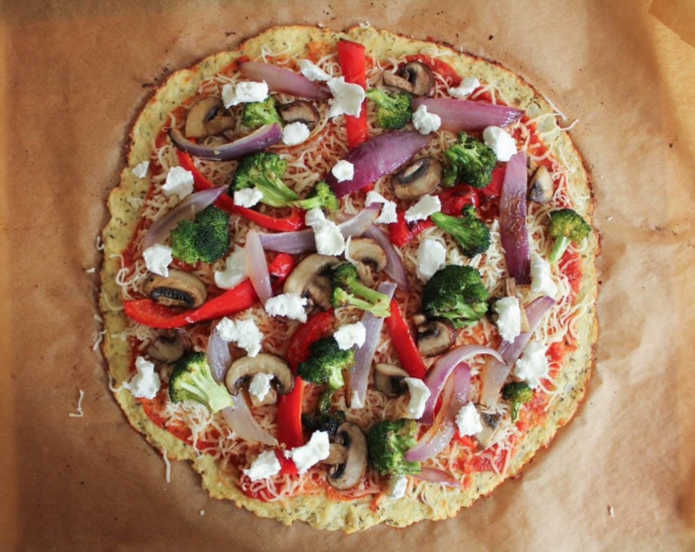 step 15 Spread the Pizza Sauce (4 Tbsp) over the pizza dough and sprinkle with an even layer of Shredded Part-Skim Mozzarella Cheese (1/2 cup). Top with the roasted vegetables, sautéed mushrooms, and Goat Cheese (2 Tbsp).