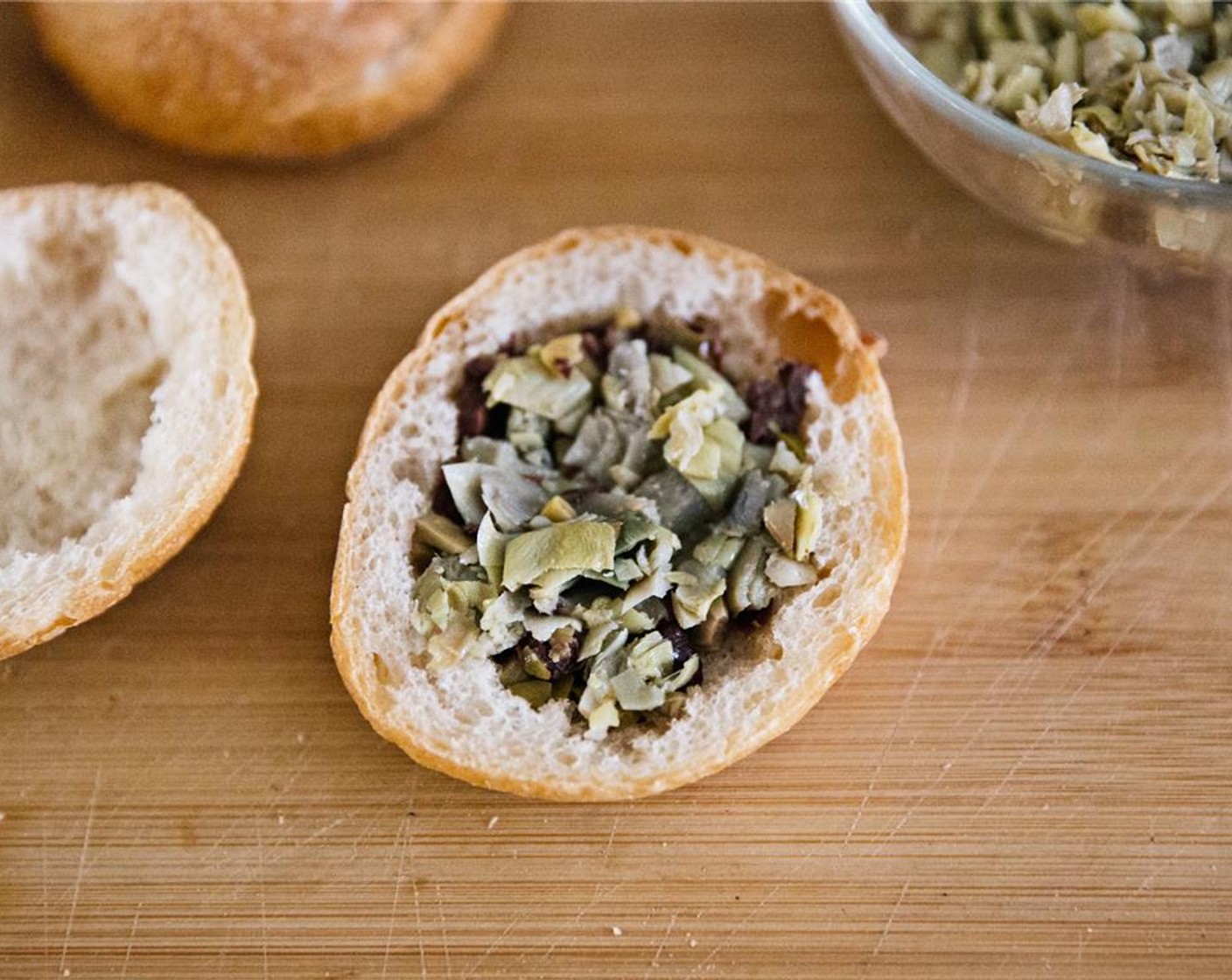 step 6 Spread with chopped artichokes.