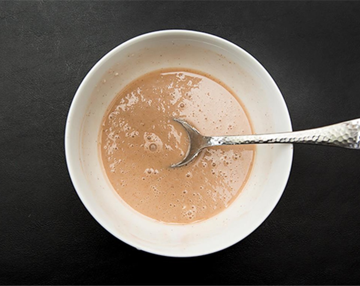 step 11 To make the glaze, combine sifted Powdered Confectioners Sugar (3/4 cup), 2 Tbsp reserved apple cinnamon filling juices, 2 tsp Lemon Juice and Milk (2 tsp).