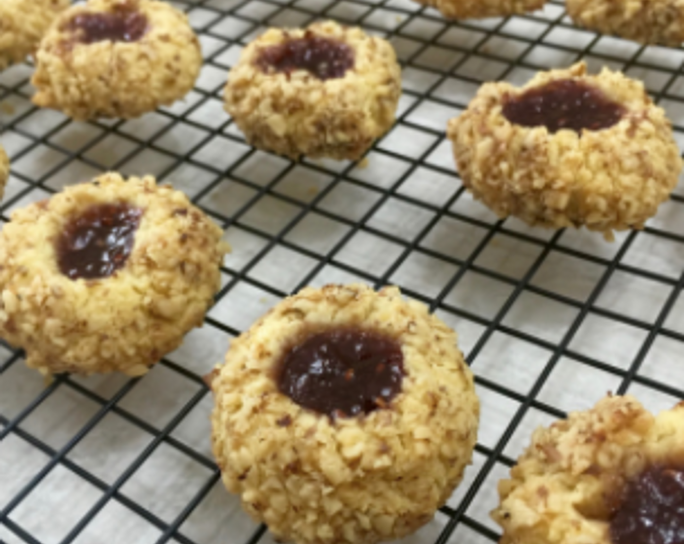 step 28 Then transfer the thumbprint cookies to another cooling rack to cool completely. And we're done!