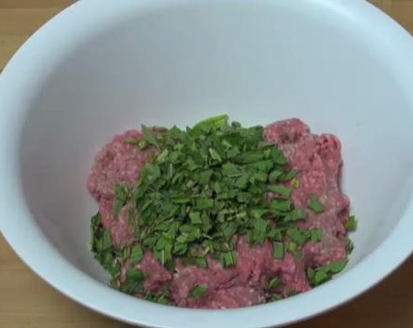 step 1 Into a bowl, add the Ground Lamb (2.2 lb), Garlic (2 cloves), and Fresh Mint (1 cup). Using your hands, mix everything together.