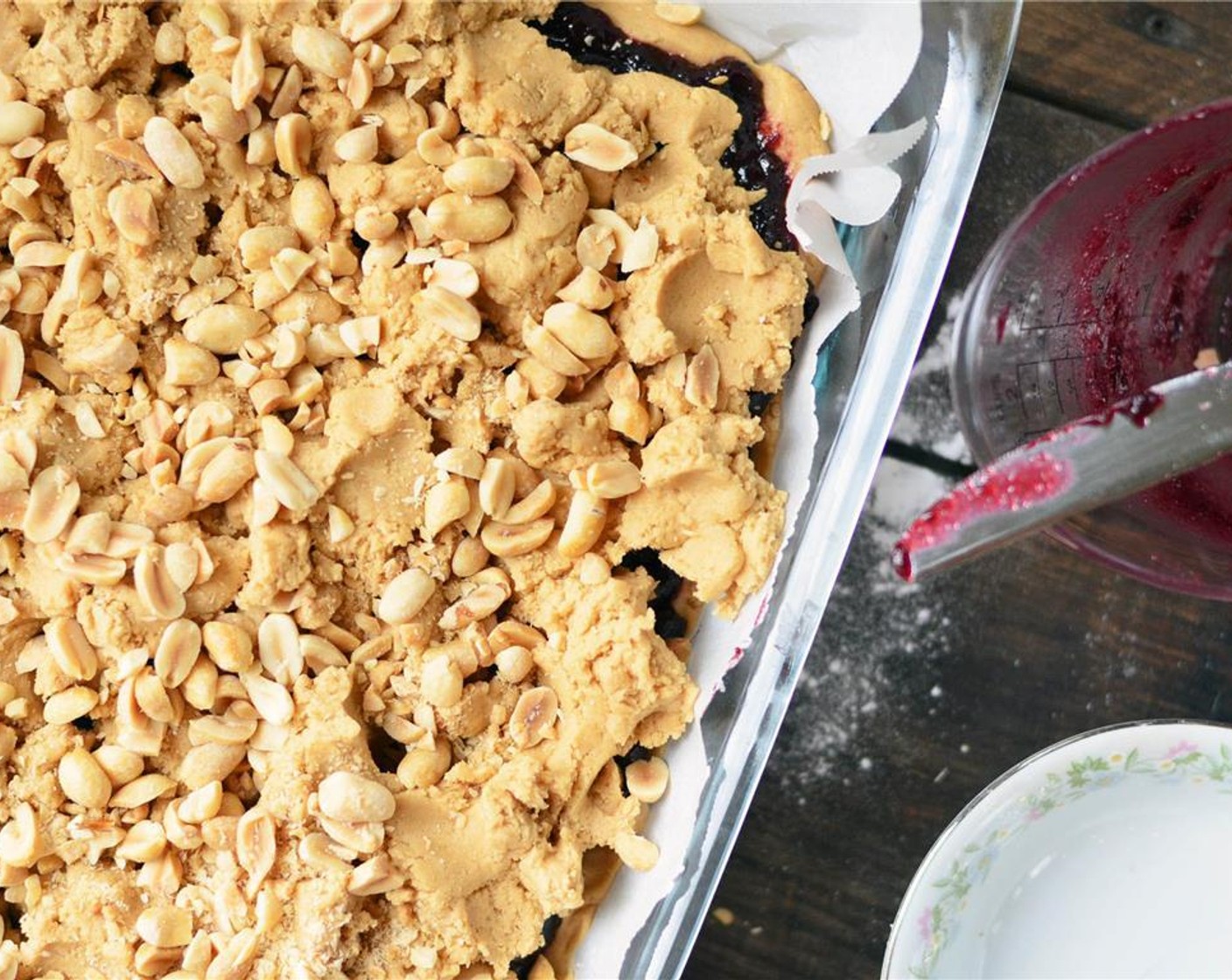 step 6 Scatter remaining crust over top of jelly and top with Dry Roasted Peanuts (1/2 cup). Place in preheated oven and bake for 30 to 35 minutes, until top is golden brown.