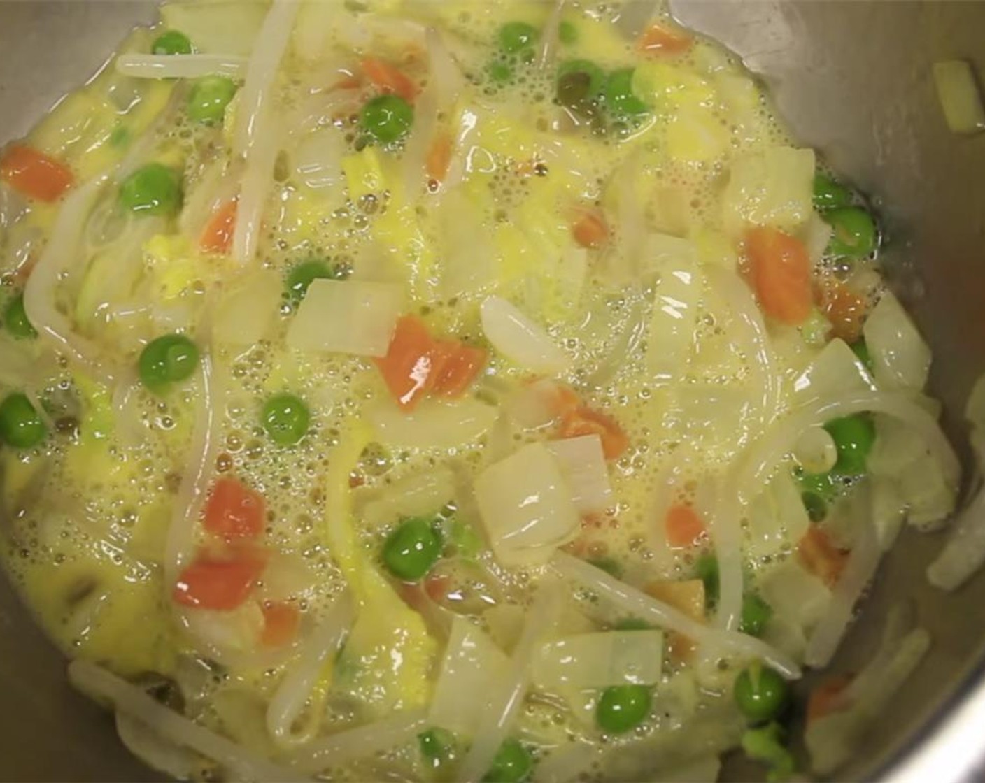 step 12 Crack the Large Eggs (2) and add them in. Mix the eggs and vegetables together just until there are no egg whites and all vegetables are coated.