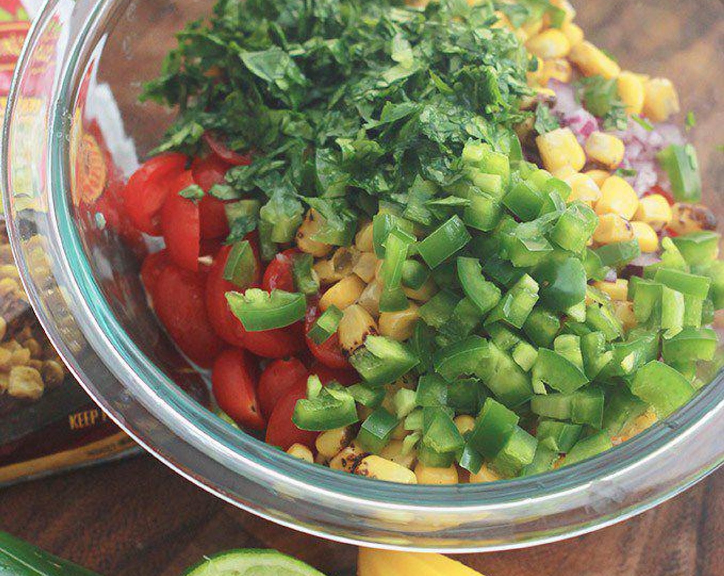 step 1 In a medium bowl, combine Grape Tomatoes (1 1/3 cups), Fire Roasted Corn Kernels (1 cup), Red Onion (1/3 cup), Garlic (2 cloves), Jalapeño Pepper (1) and Fresh Cilantro (4 Tbsp). Add zest and juice from Lime (1) and Sea Salt (1/2 tsp). Stir to combine.