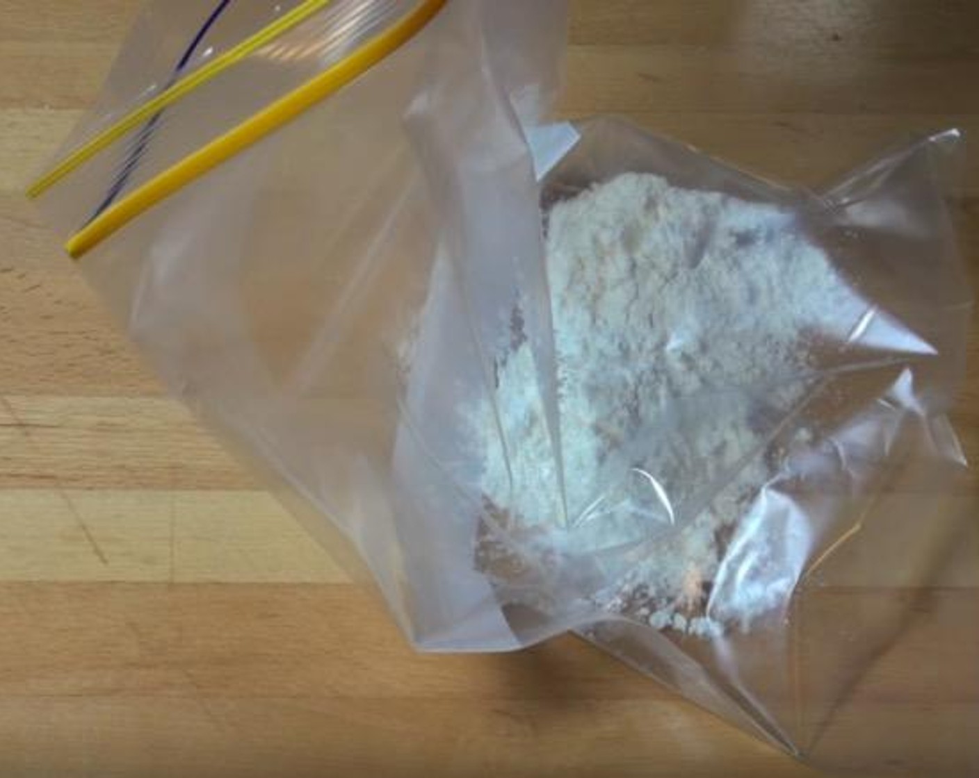 step 2 In a Ziploc freezer bag, add All-Purpose Flour (4 Tbsp), Corn Flour (2 Tbsp), Salt (to taste) and Ground Black Pepper (to taste), Garlic Powder (1 tsp) and Chili Powder (1/2 tsp). Shake to mix.