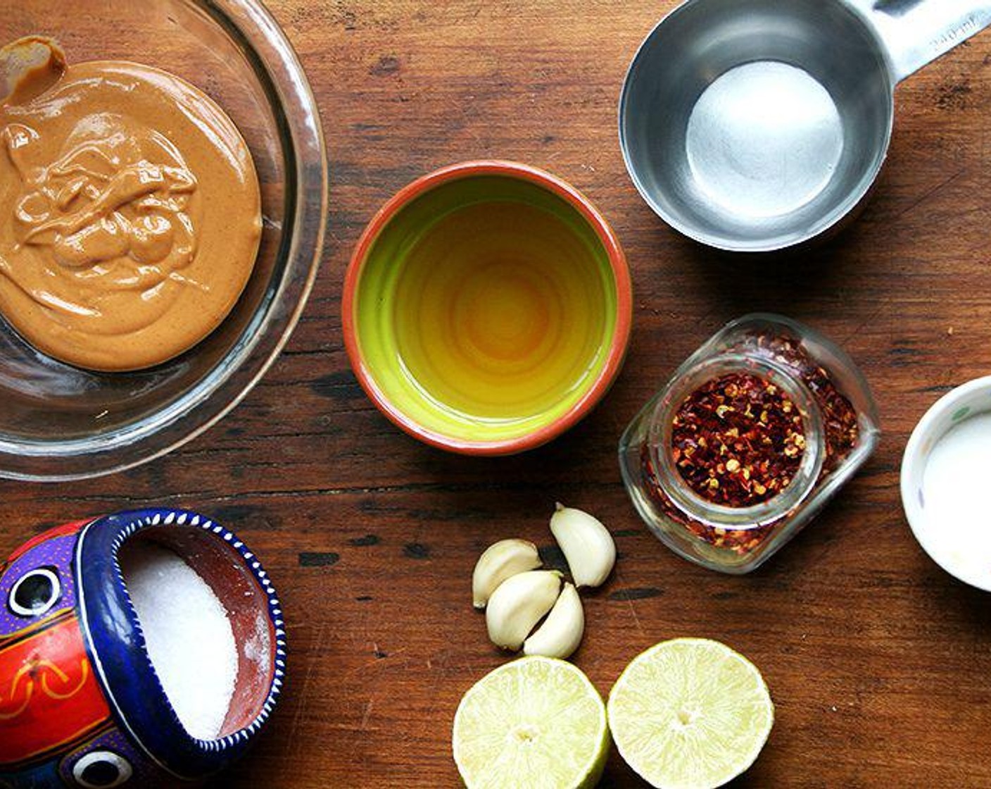 step 3 Place the Peanut Butter (1/3 cup) in a bowl and whisk in the Water (1 cup) until blended. Stir in Apple Cider Vinegar (4 Tbsp), Granulated Sugar (1 Tbsp), Kosher Salt (1 tsp), Garlic (3 cloves), Crushed Red Pepper Flakes (to taste), the juice from Lemon (1), Sesame Oil (1 Tbsp), Sriracha (to taste), Hot Sauce (to taste). Taste.