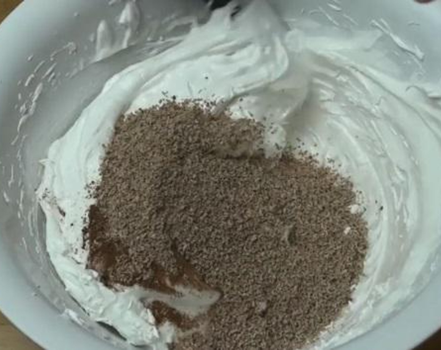 step 2 Add in the Vanilla Extract (2 tsp), Corn Flour (2 tsp), Distilled White Vinegar (1 tsp), Unsweetened Cocoa Powder (4 Tbsp), and Milk Chocolate (1/3 cup), and combine everything together.