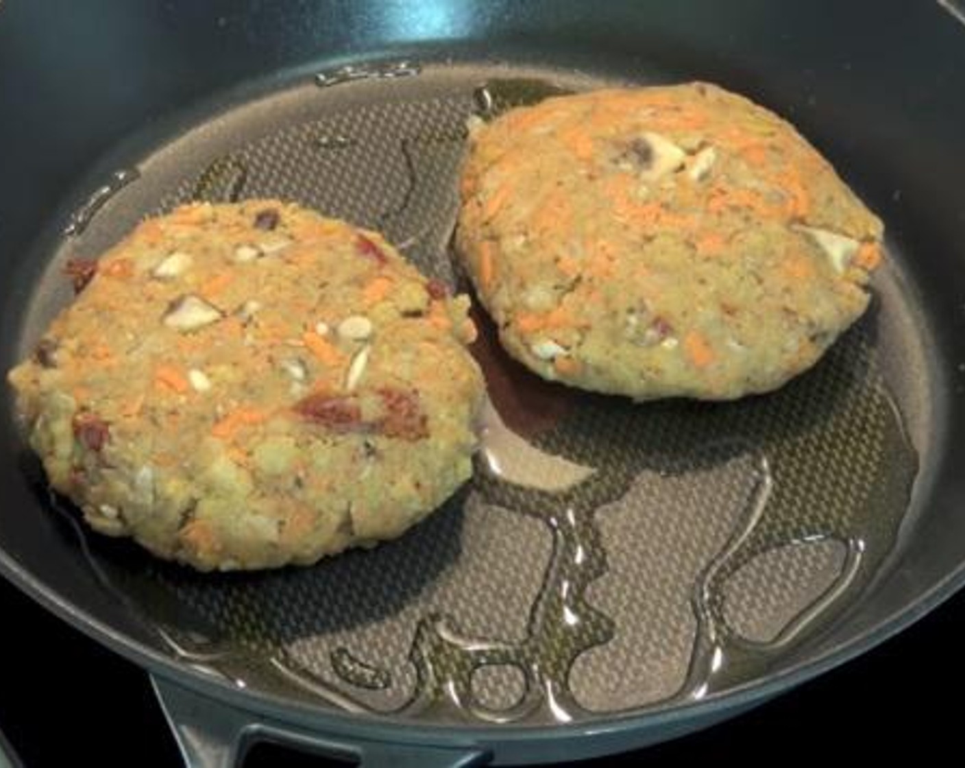 step 2 Divide the mixture into 4 portions, and form each portion into a patty. Fry the patties over medium heat for about 4 minutes on each side.