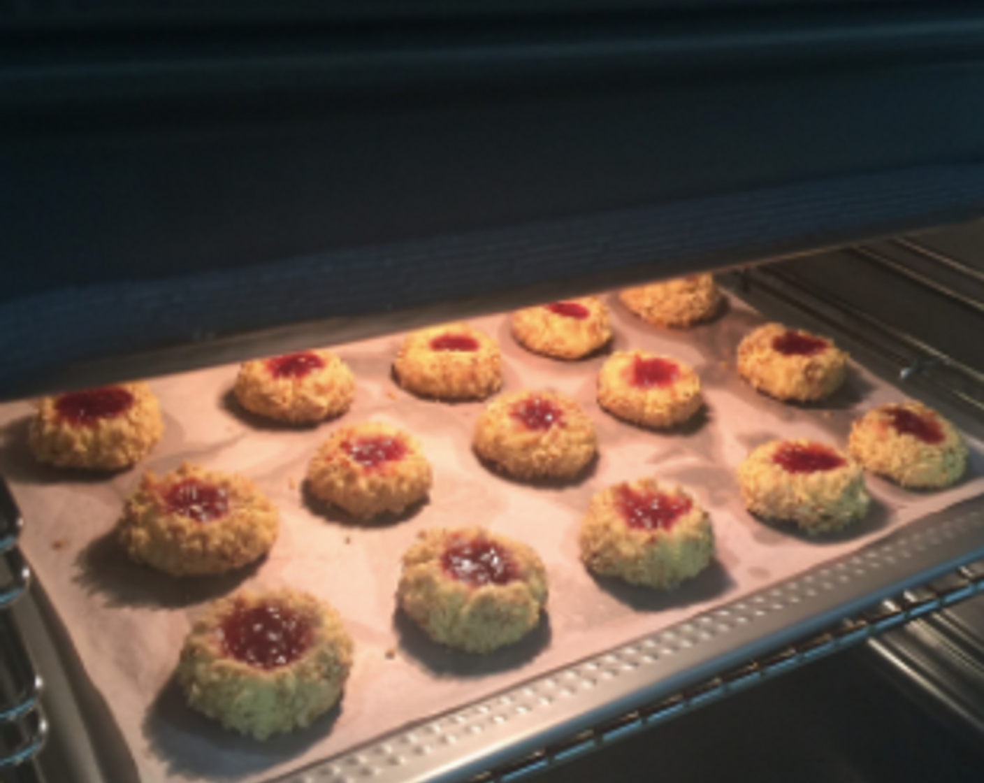 step 26 Then, bake in the preheated oven for 12 to 15 minutes until the edges of cookies are golden and the nuts have browned. Just touch the cookies and they should be firm when done.