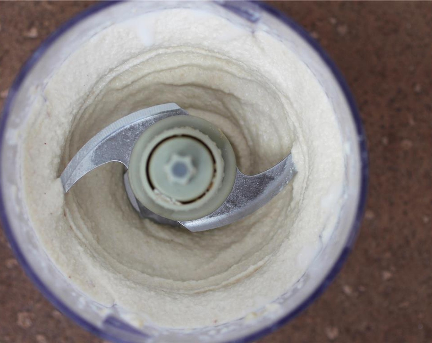 step 6 Melt the Coconut Oil (4 Tbsp) on the stovetop or microwave and add to the cashew mixture, and blend well.
