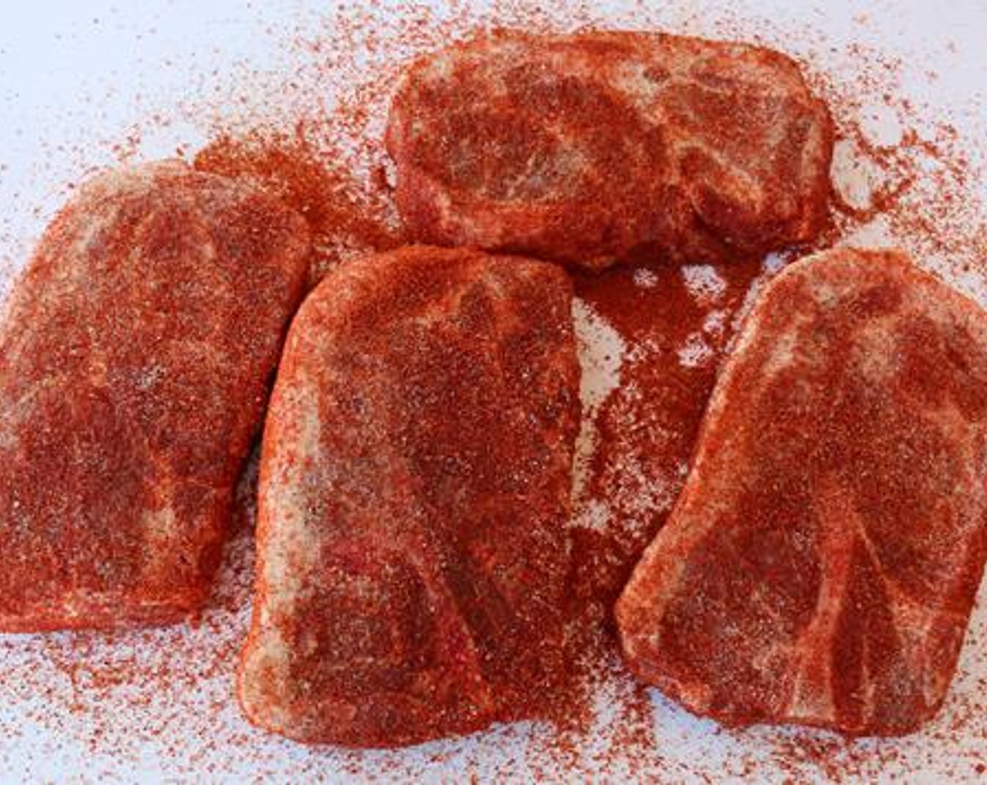 step 2 Season the outside of each Boneless Pork Shoulder (4) with All-Purpose Spice Rub (4 Tbsp) followed by Barbecue Rub (4 Tbsp). Substitute your favorite seasonings if you wish. Pork shoulder should be around 1 1/4-inch thick.