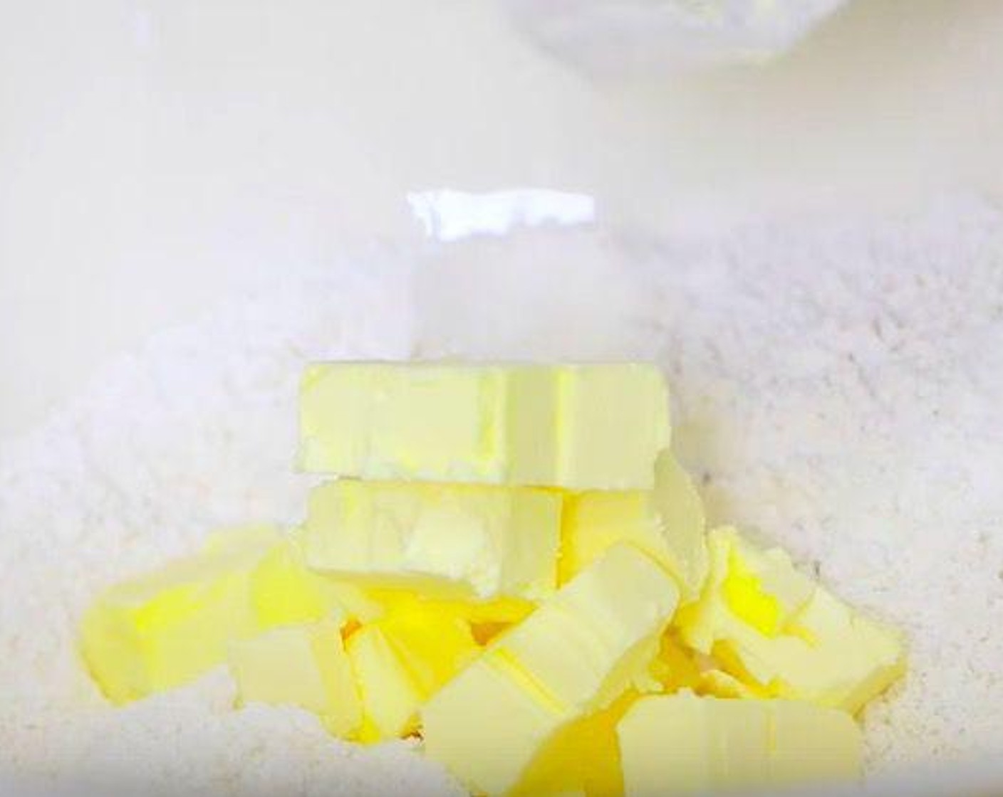step 1 Take a large bowl and add All-Purpose Flour (2 cups), Caster Sugar (1 Tbsp), Baking Powder (2 tsp) and Salt (1/2 tsp). Mix it. Put Butter (1/2 cup) into the bowl and incorporate with fingers. Add Sharp Cheddar Cheese (1 1/2 cups), Bacon (7 slices) and Scallion (1/2 cup). Mix it well and set aside.