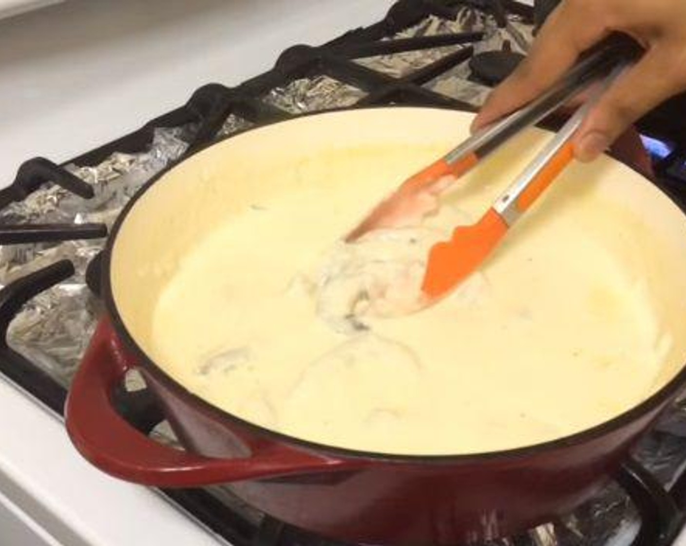 step 3 Then, Whisk in the Evaporated Milk (2 cups) a little bit at a time. Add in the Parmesan Cheese (1 cup) and seasoned Shrimp (1 lb) to the sauce. Put the lid on and let it cook for about 4 minutes.