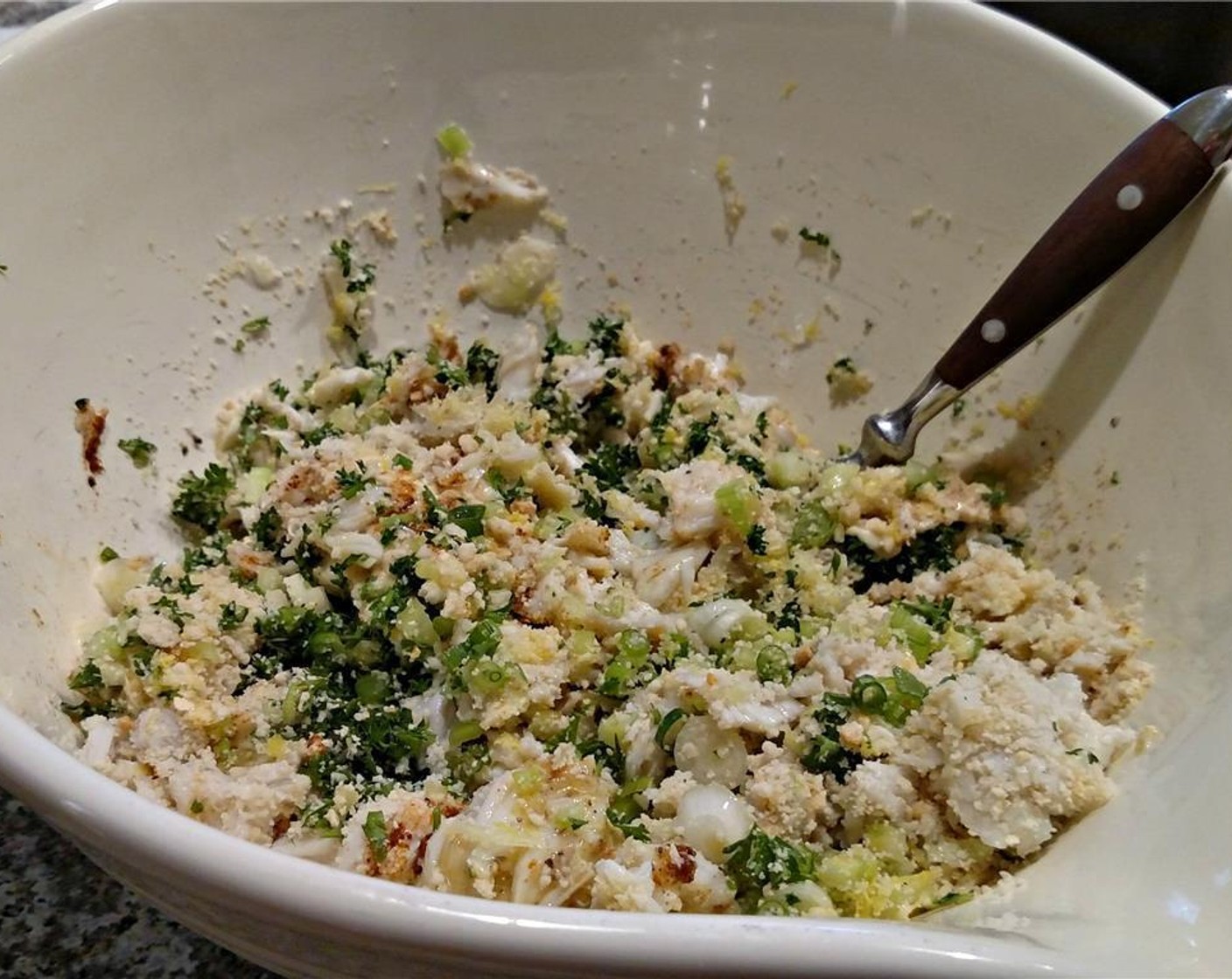 step 2 In a large bowl, mix Celery (1/2 cup), Scallion (1/2 cup), Egg (1), Lemon (1), Gluten-Free Bread (1 cup), Fresh Parsley (1/2 cup), Mayonnaise (1/3 cup), Worcestershire Sauce (1 tsp), Old Bay® Seasoning (1 tsp), Dijon Mustard (1 tsp), Salt (1/4 tsp), and Ground White Pepper (1/4 tsp). Carefully add the crab last, taking care not to break up the lumps as you incorporate it.