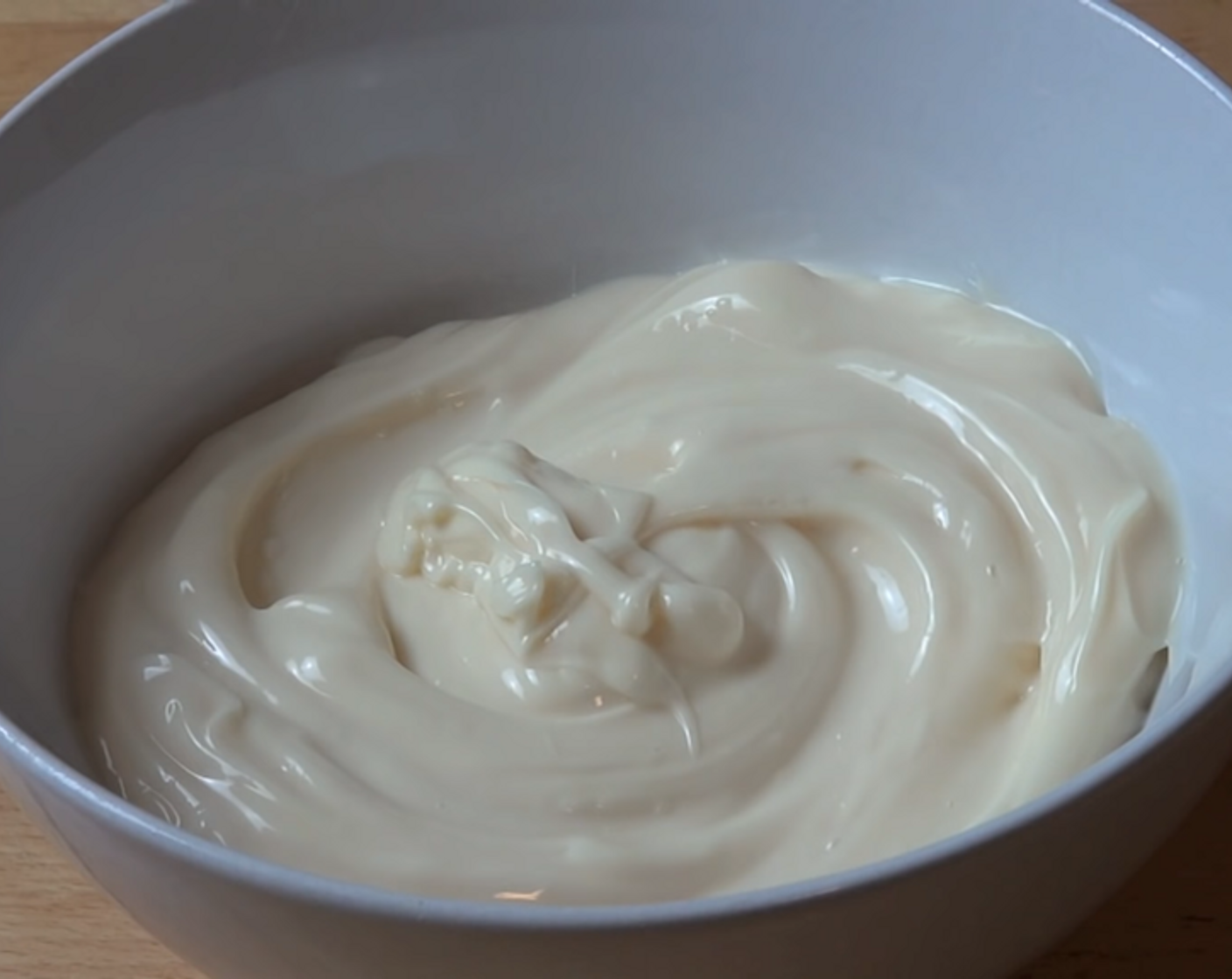 step 3 Into a mixing bowl, add your Mayonnaise (2 cups), Onion Salt (1 tsp), and Garlic Powder (1 Tbsp). Season with some Freshly Ground Black Pepper (to taste) and mix everything together.