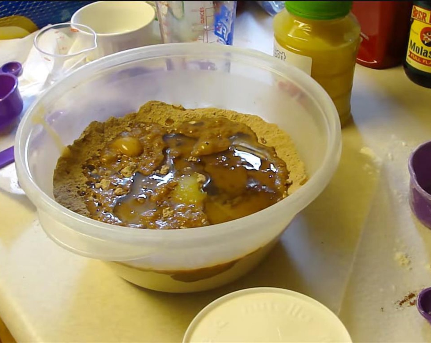 step 3 Pour in Water (1 cup), Apple Sauce (4 Tbsp), and Canola Oil (1/2 cup).  Mix until well blended. Spread evenly in a greased 9x13 inch baking pan.