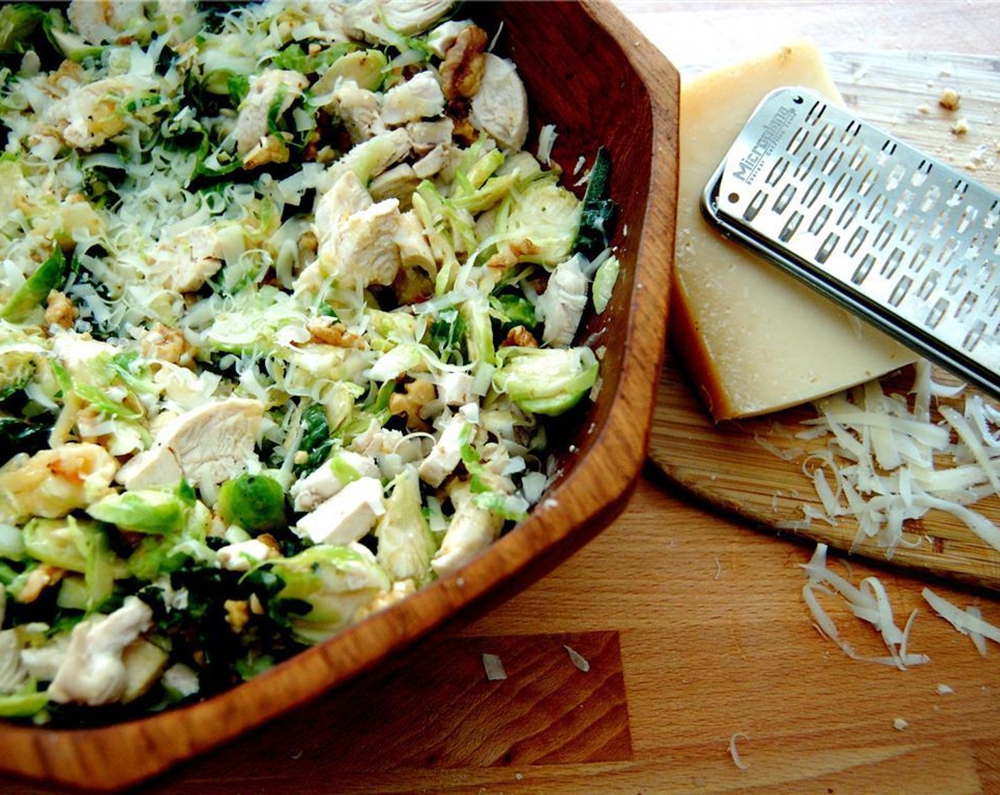 step 6 Toss together the vegetables, Parmesan Cheese (4 Tbsp), Shredded Chicken (1 cup), walnuts and dressing. Serve warm or cold.