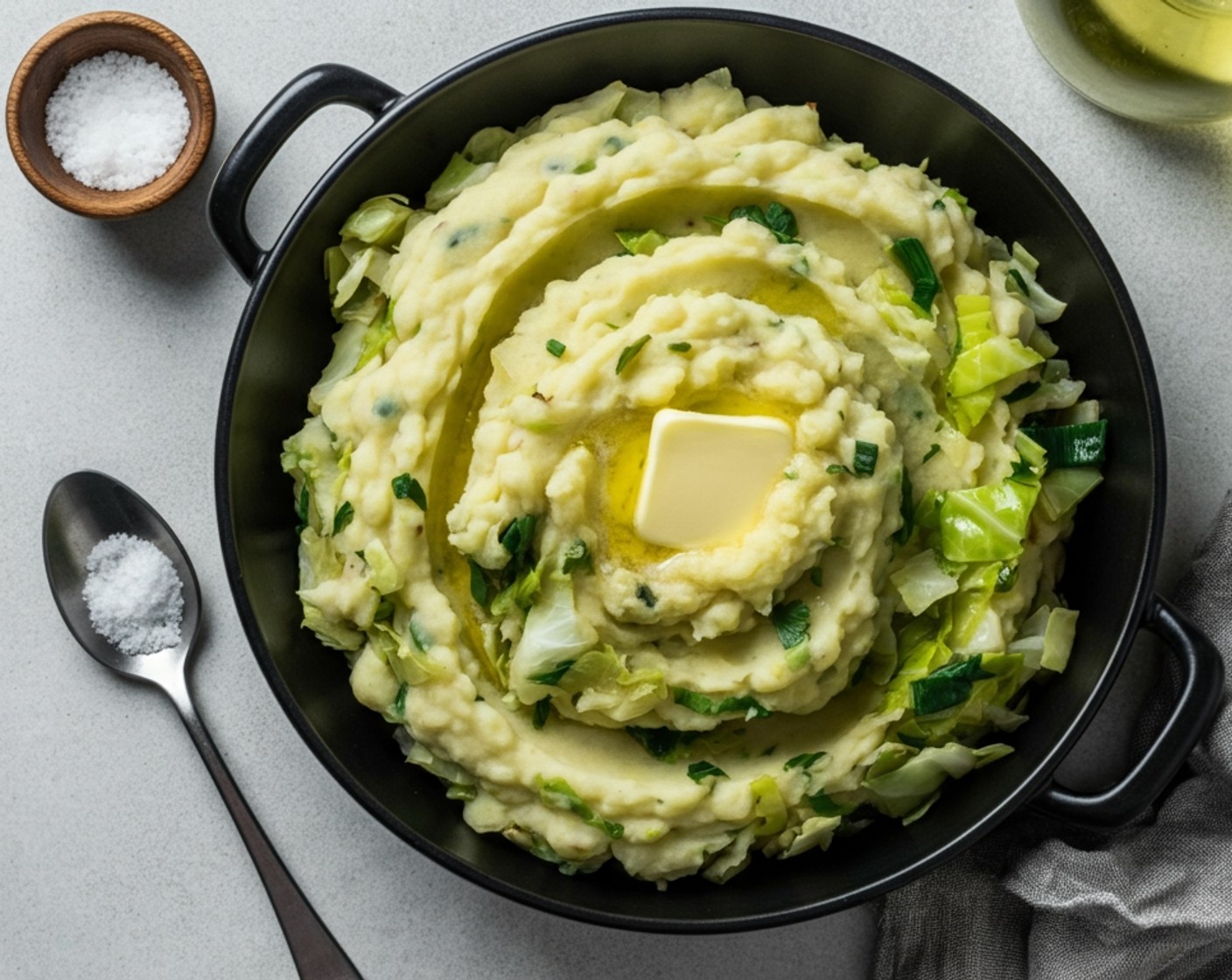 step 5 Serve the Colcannon warm in a serving dish. For an extra touch, add a small pat of butter on top and sprinkle with Spring Onions (to taste) before serving.